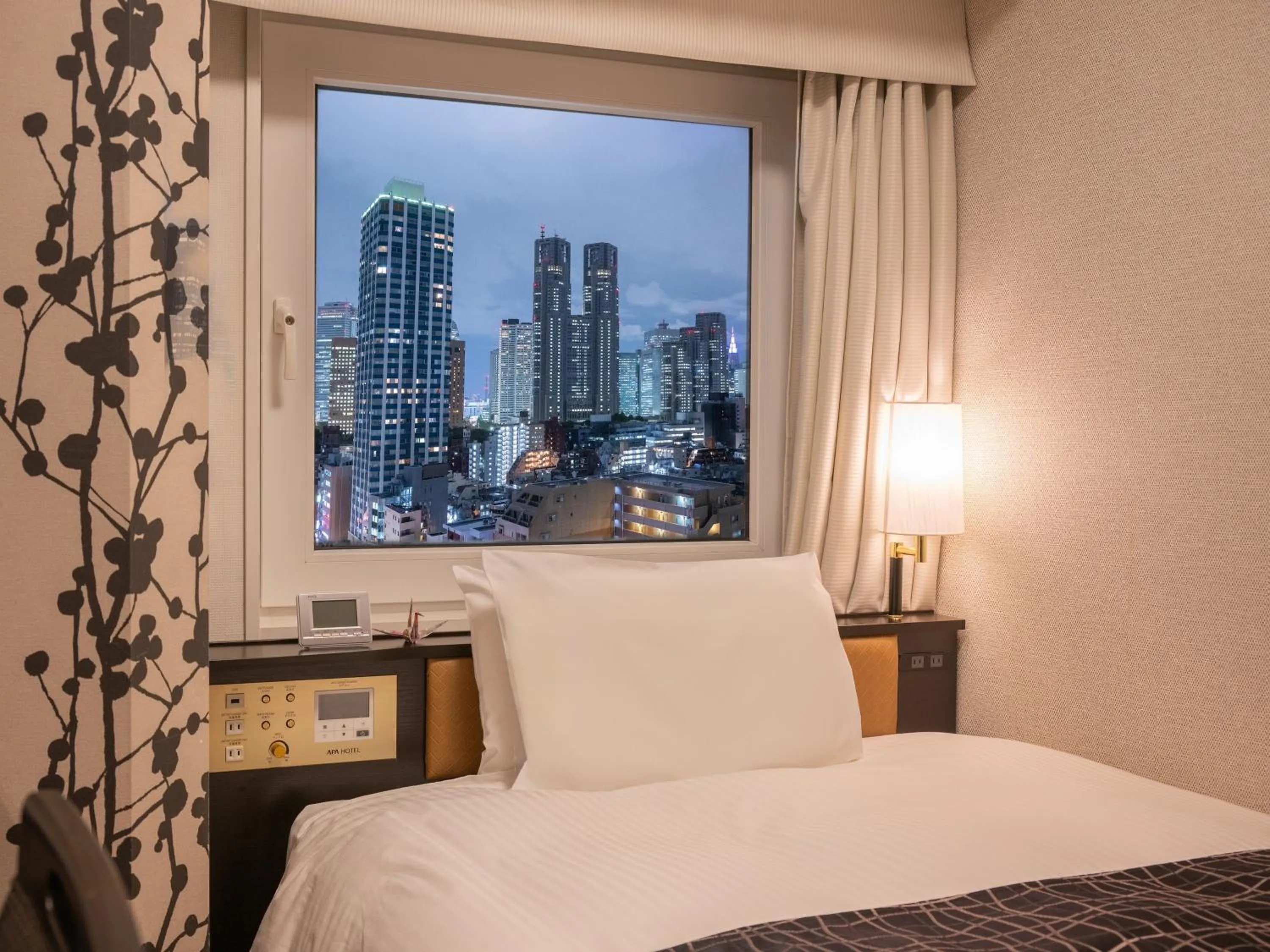 Photo of the whole room, Bed in APA Hotel & Resort Nishishinjuku Gochome Ekimae Tower - Formerly APA Hotel & Resort Nishishinjuku Gochome Eki Tower