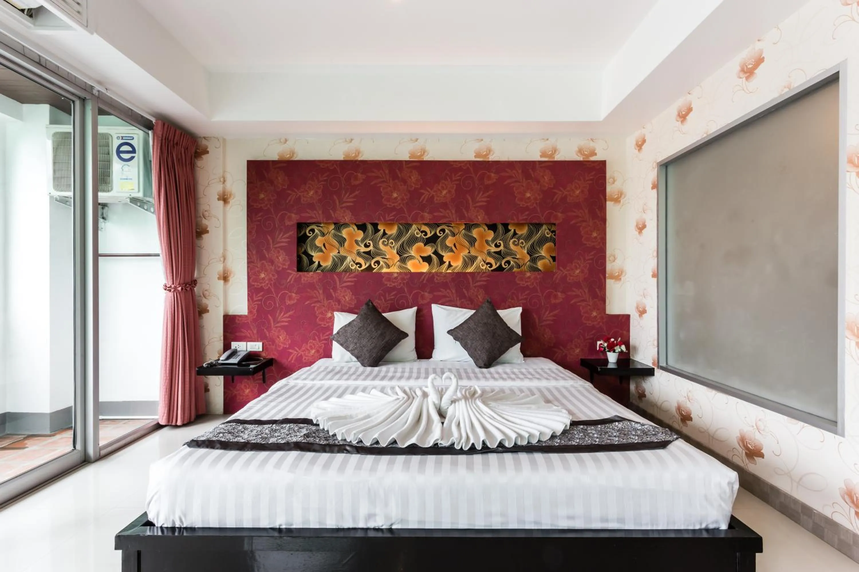 Bed in 7Q Patong Beach Hotel