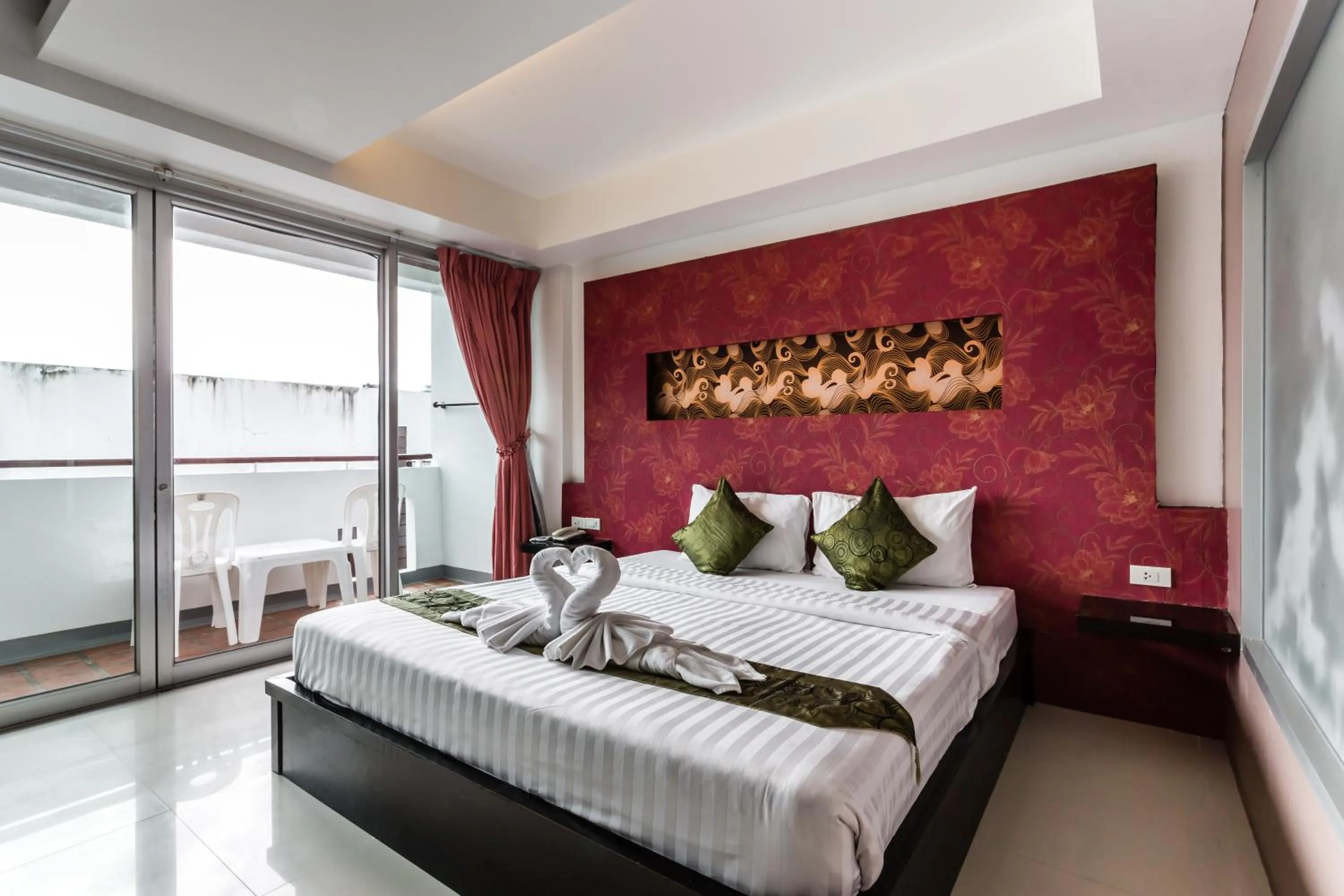 Bed in 7Q Patong Beach Hotel