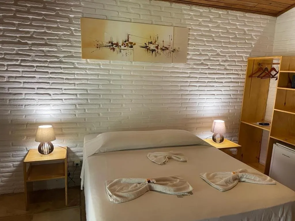 Bed in Pousada Villa Caju