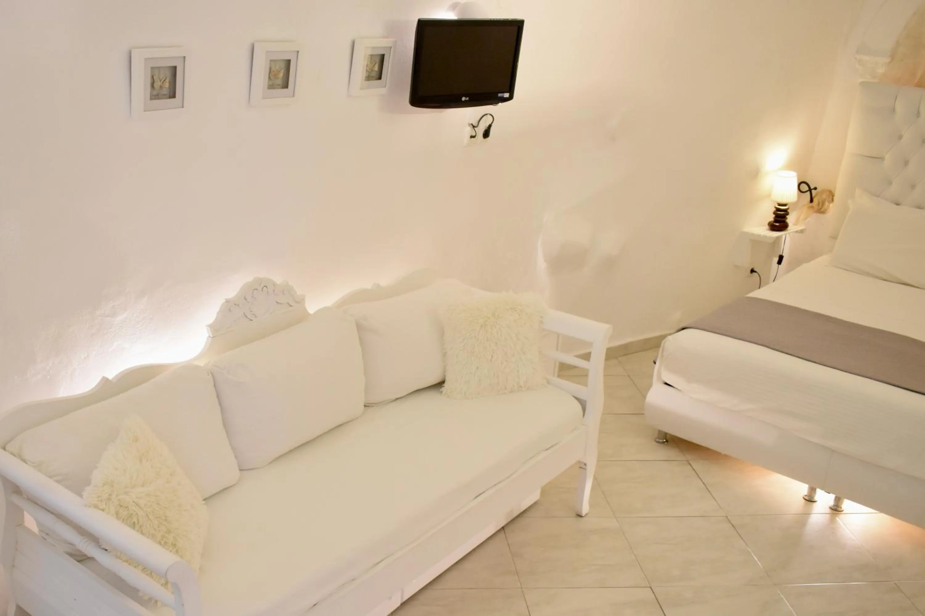 Seating area, Bed in Aeolos Art & Eco Suites Adults Only