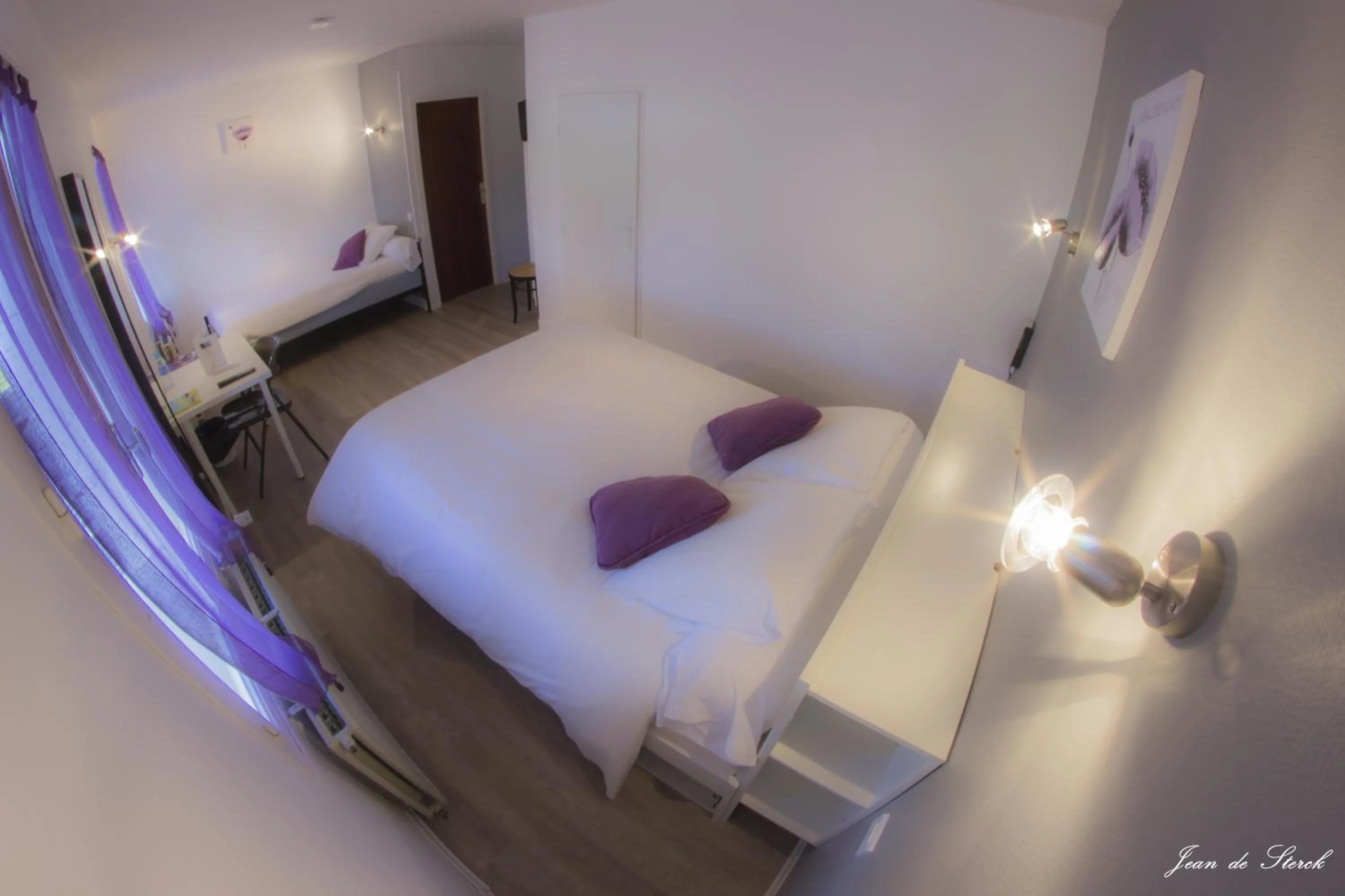 Bed in Logis Hôtel Le pont d'Arcole