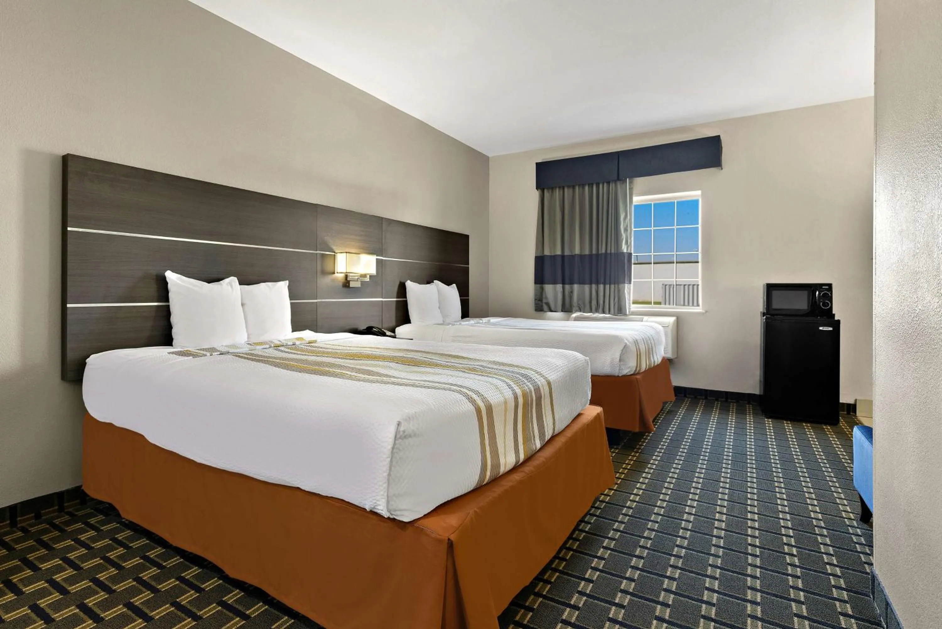 Bedroom, Bed in SureStay Plus Hotel by Best Western Tulsa East