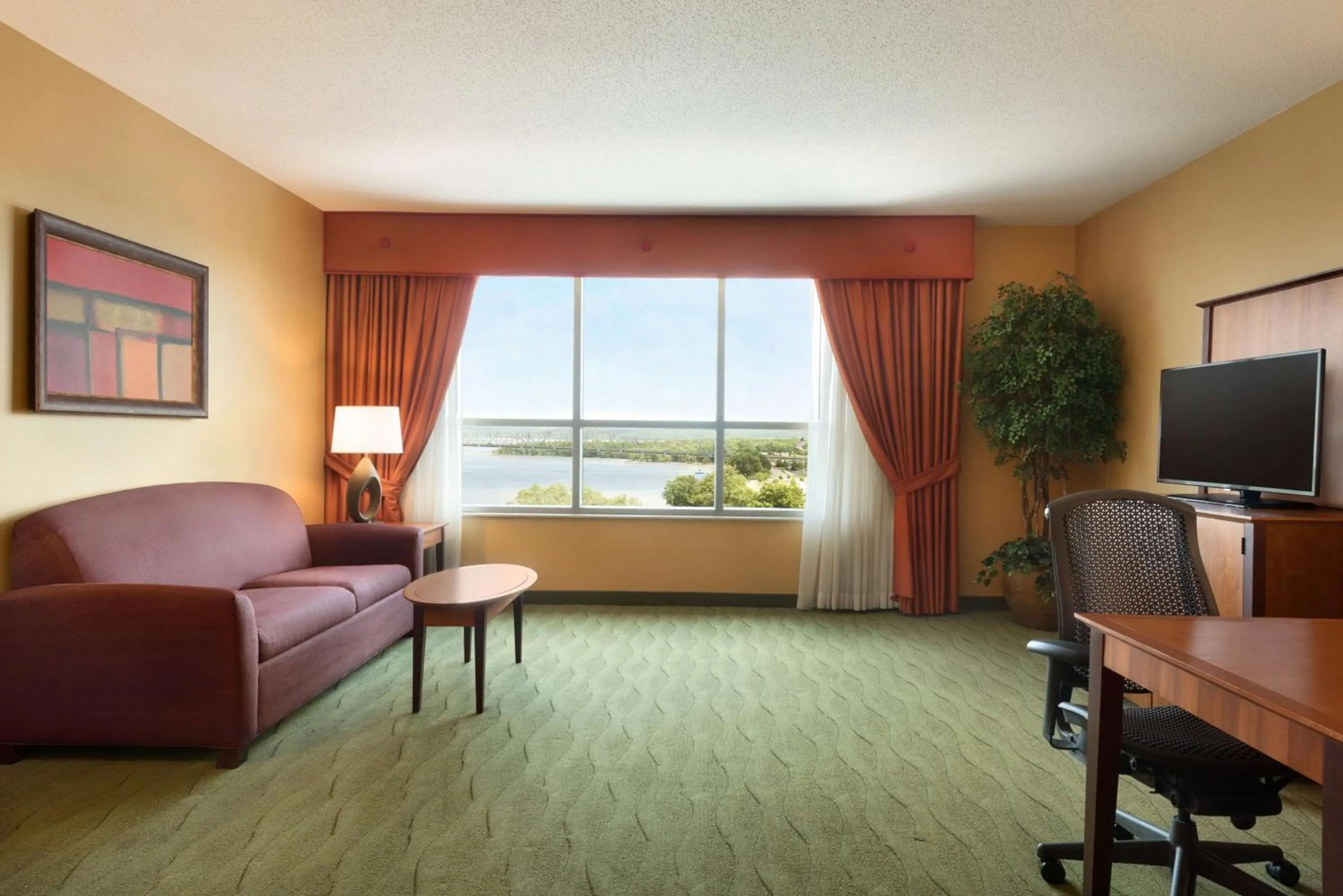 Bedroom in Embassy Suites East Peoria Hotel and Riverfront Conference Center