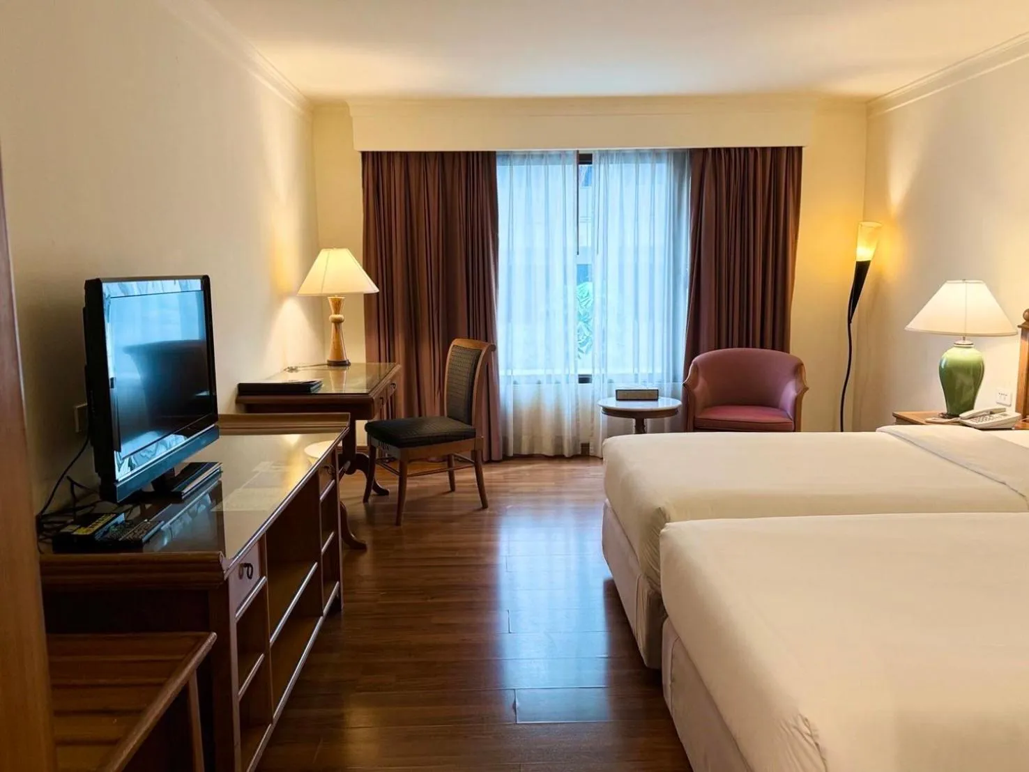 Communal lounge/ TV room, Bed in Silom Serene A Boutique Hotel