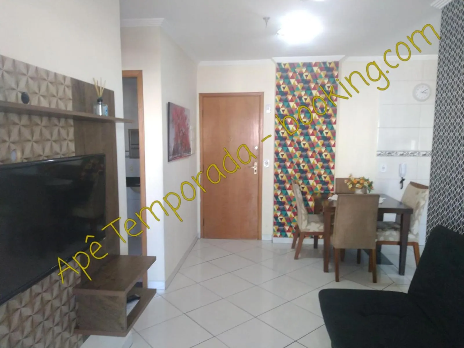 Living room in Apê Temporada Praia Grande SP Completo com Piscina, Churrasqueira, Estacionamento