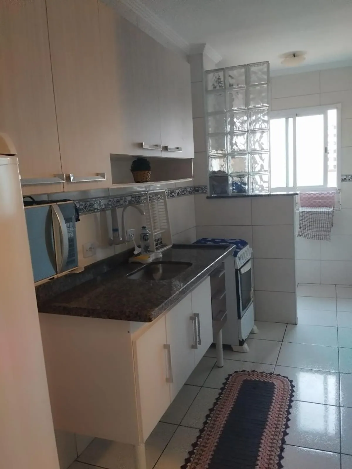 kitchen in Apê Temporada Praia Grande SP Completo com Piscina, Churrasqueira, Estacionamento