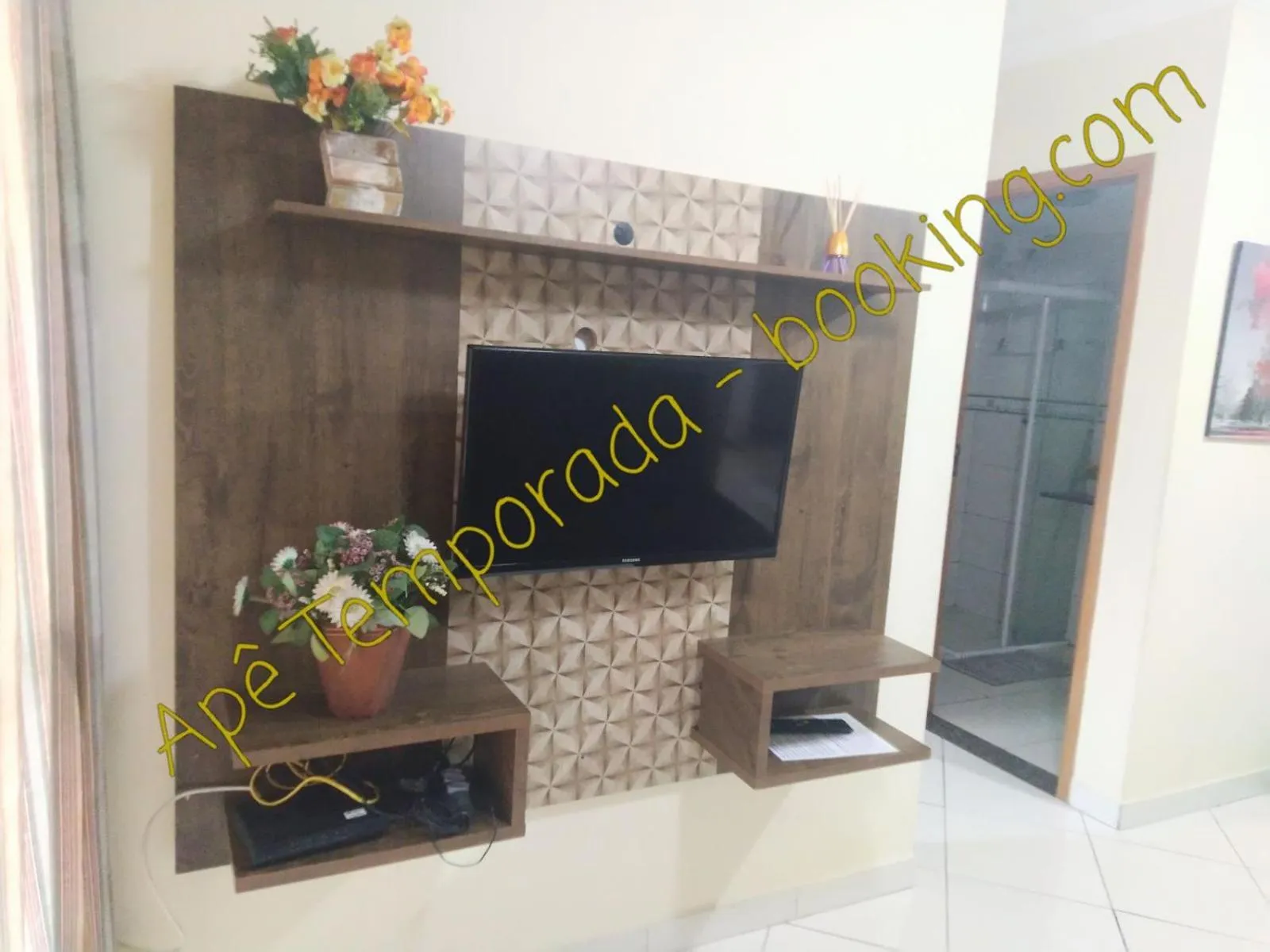 Communal lounge/ TV room in Apê Temporada Praia Grande SP Completo com Piscina, Churrasqueira, Estacionamento