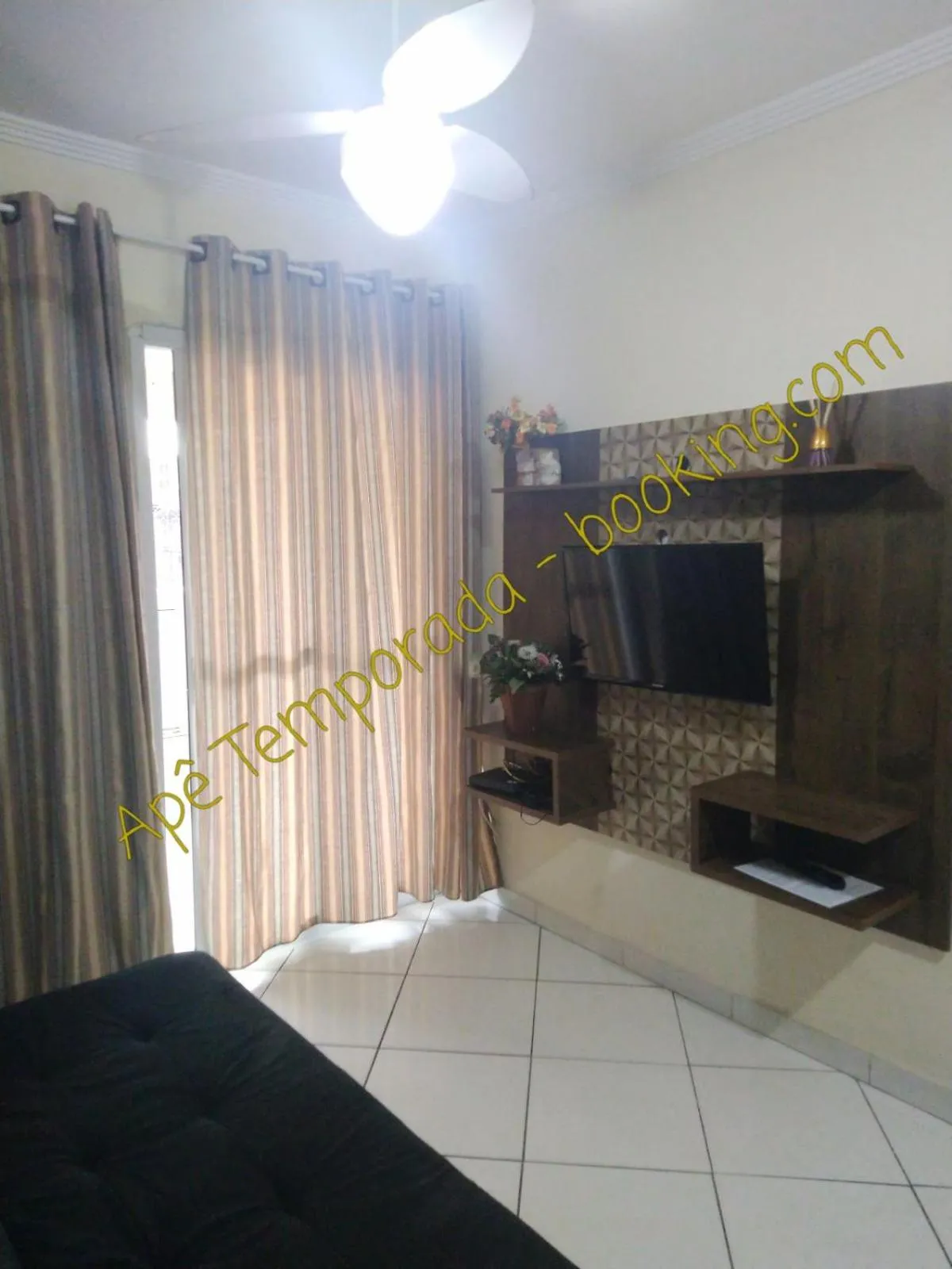 Living room in Apê Temporada Praia Grande SP Completo com Piscina, Churrasqueira, Estacionamento