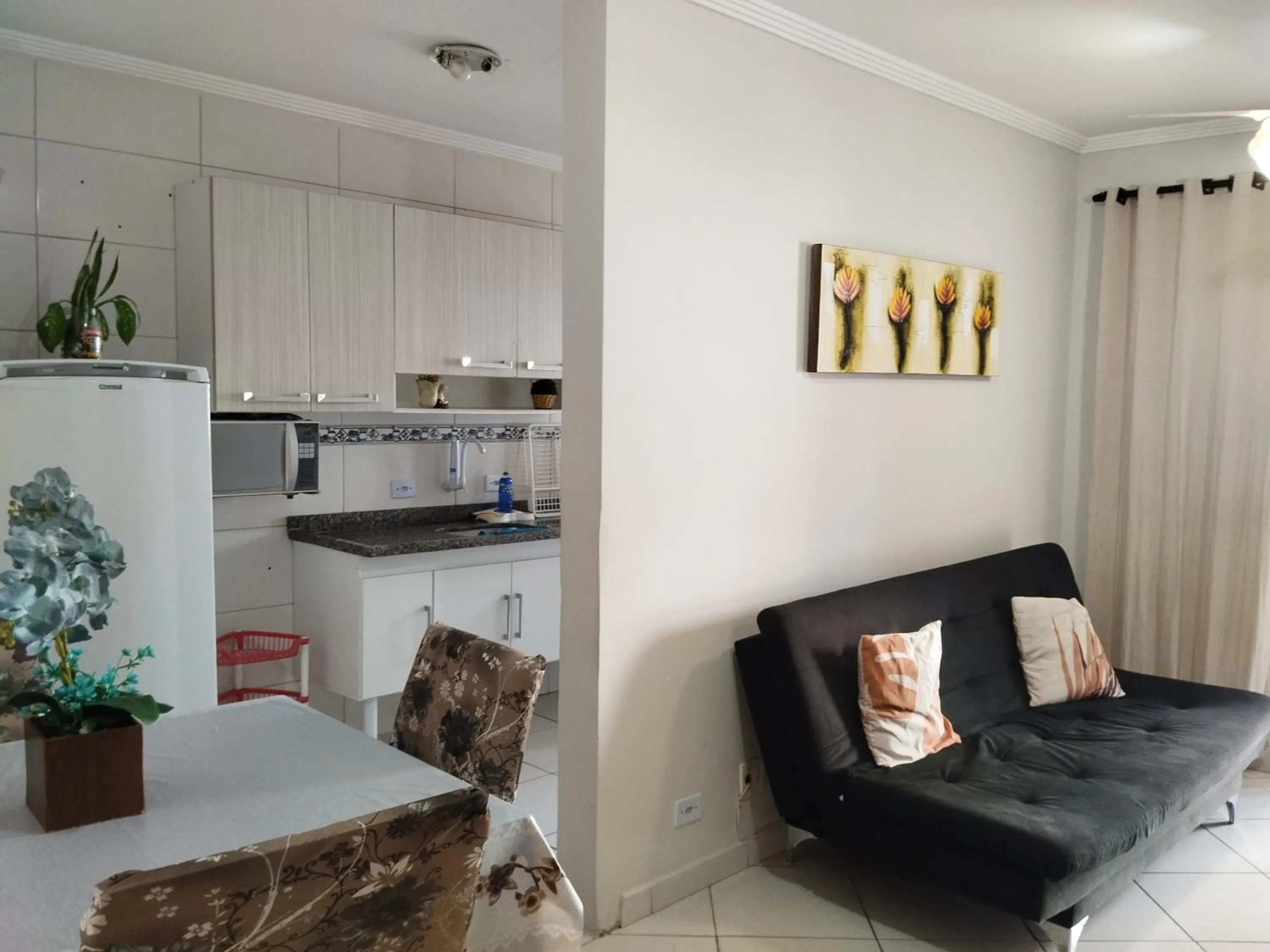 Living room in Apê Temporada Praia Grande SP Completo com Piscina, Churrasqueira, Estacionamento