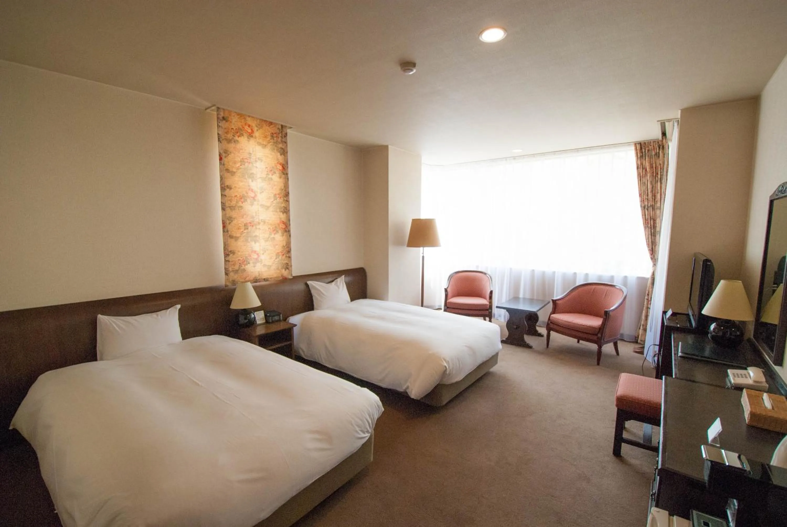 Bed in Hakuba Mominoki Hotel