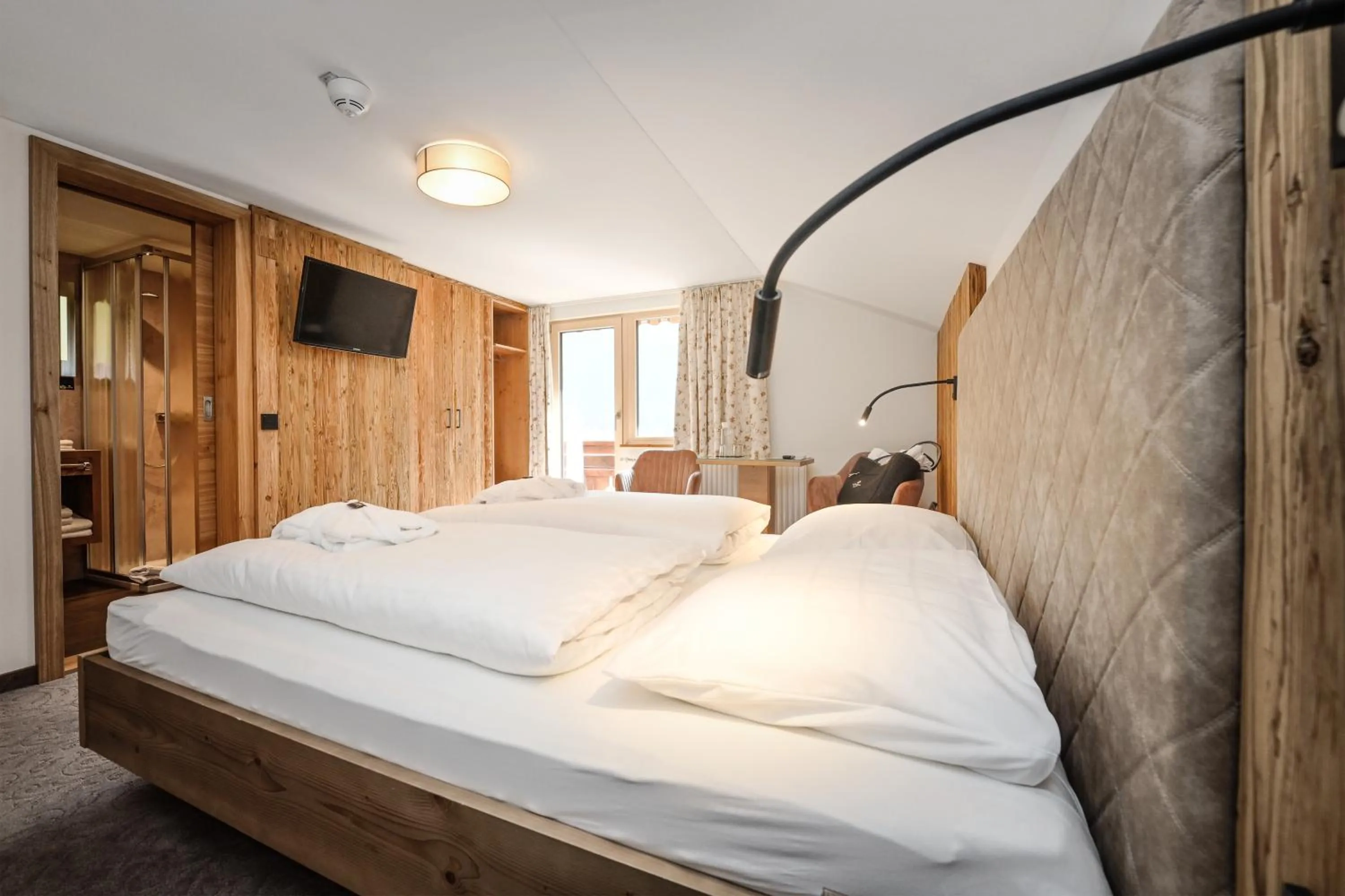 Photo of the whole room, Bed in Hotel Alpenfeuer Montafon