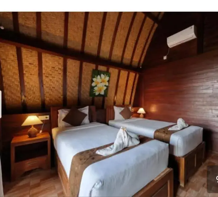 Bed in Bataran Garden Cottage Bed in Bataran Garden Cottage