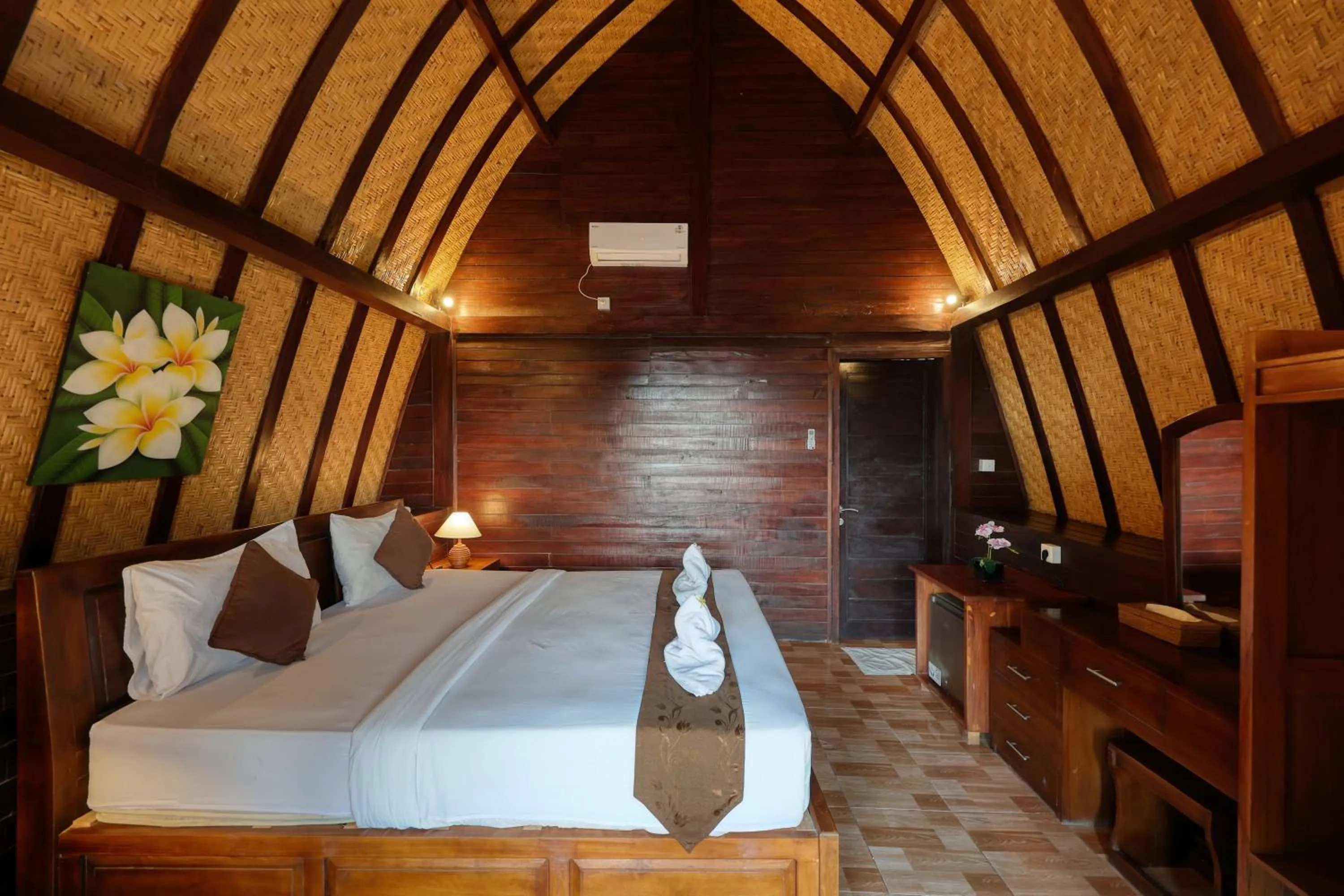 Bed in Bataran Garden Cottage