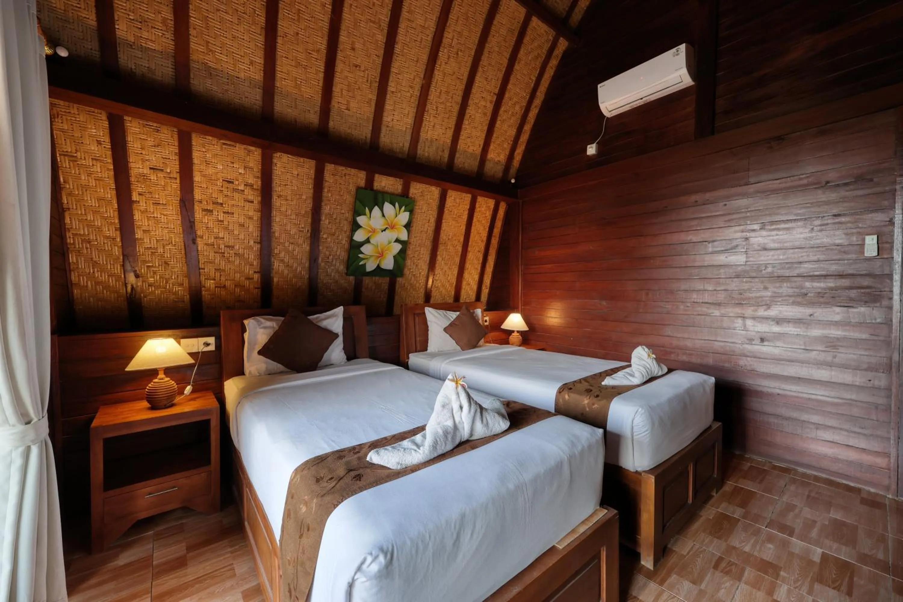 Bed in Bataran Garden Cottage