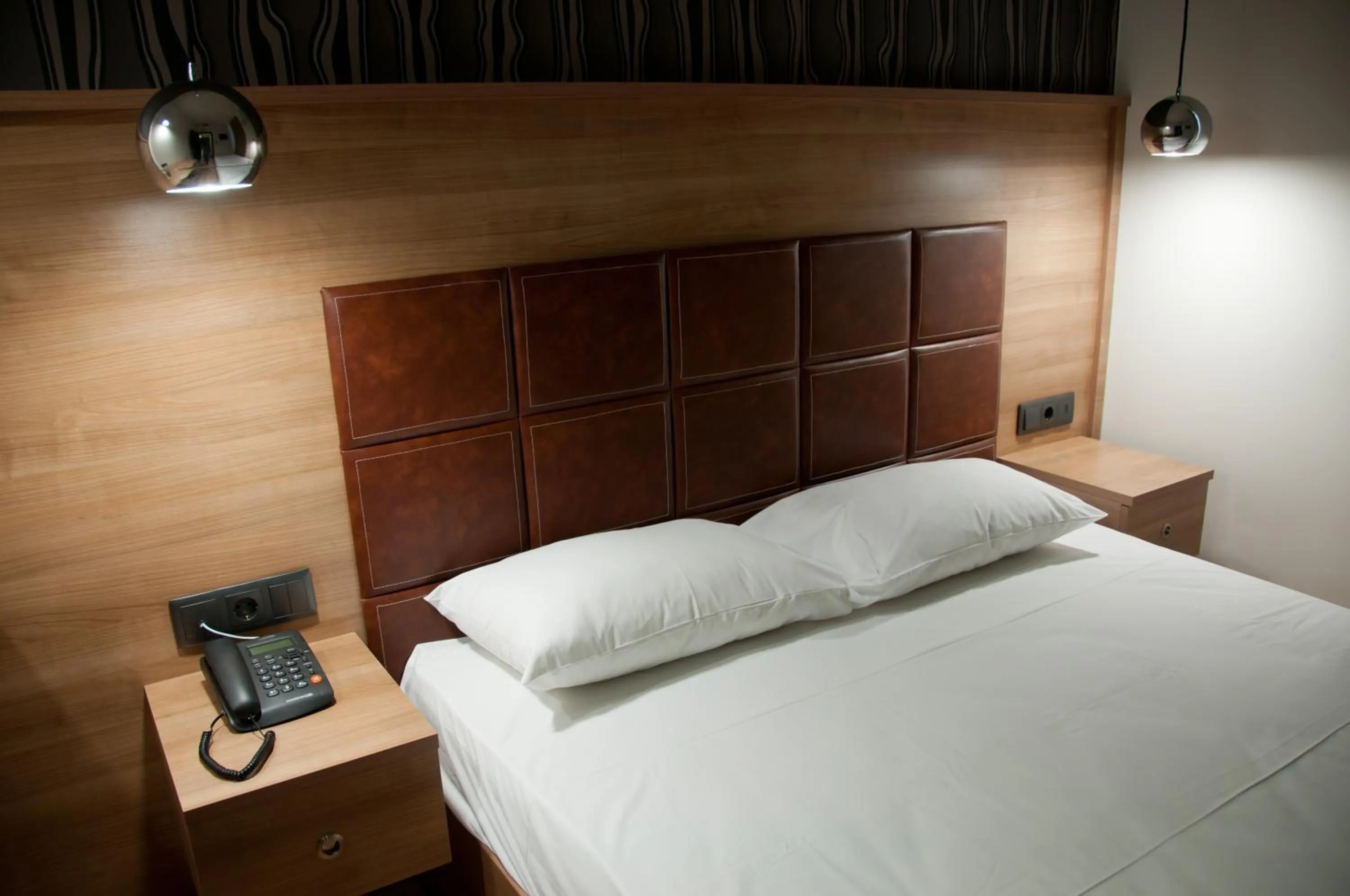 Bed in Metropolis Hotel