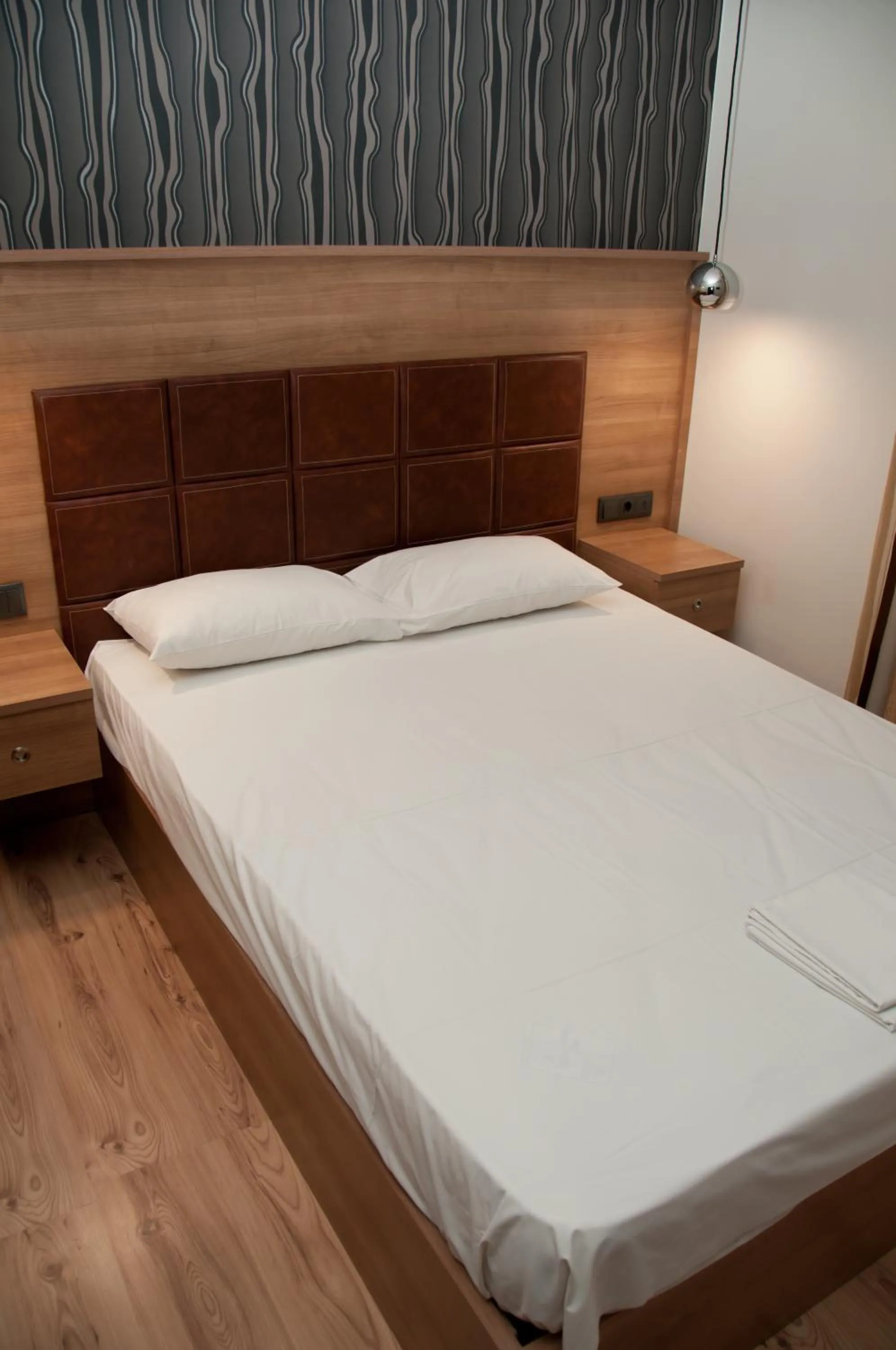 Bed in Metropolis Hotel