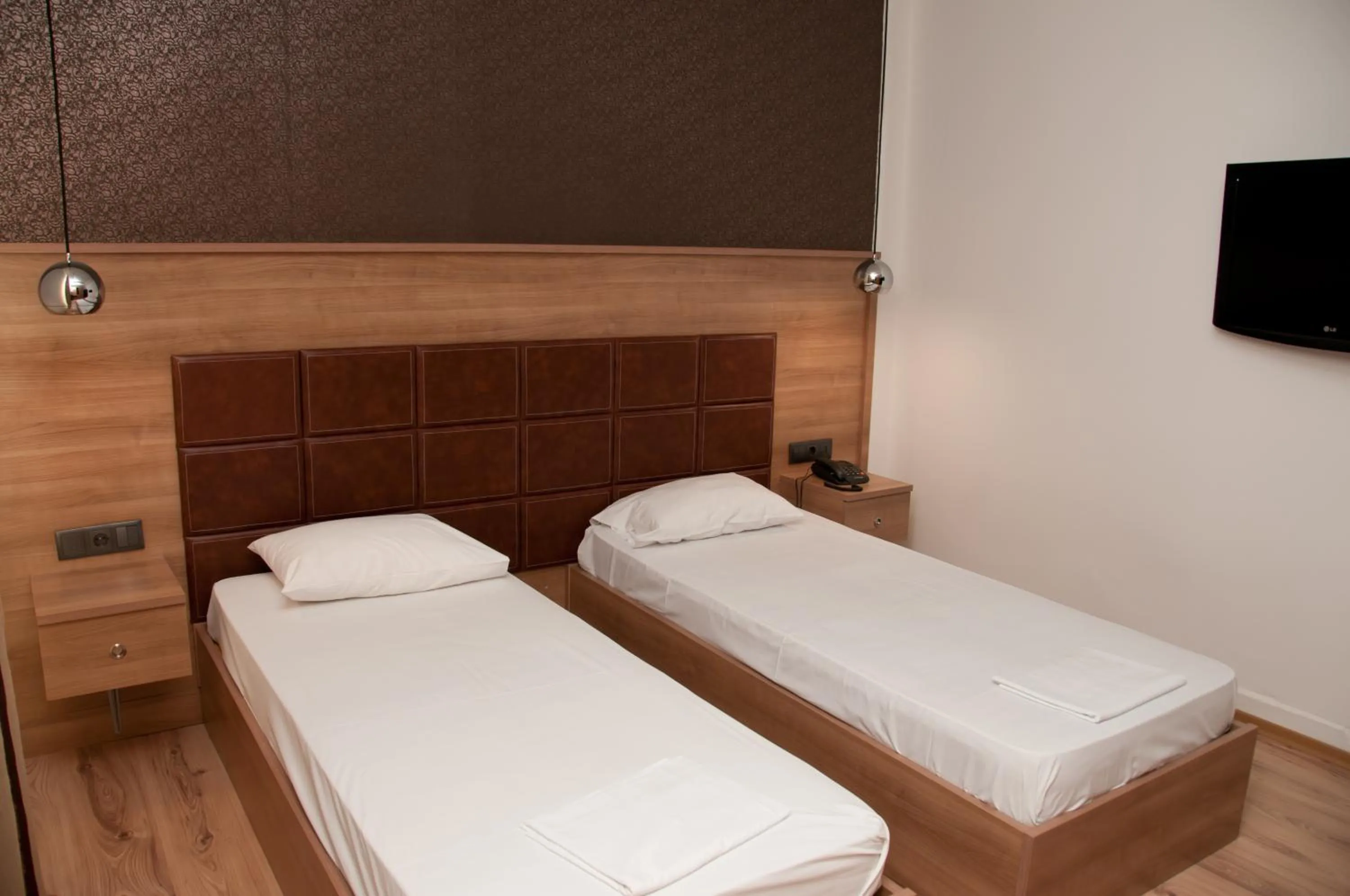 Bed in Metropolis Hotel