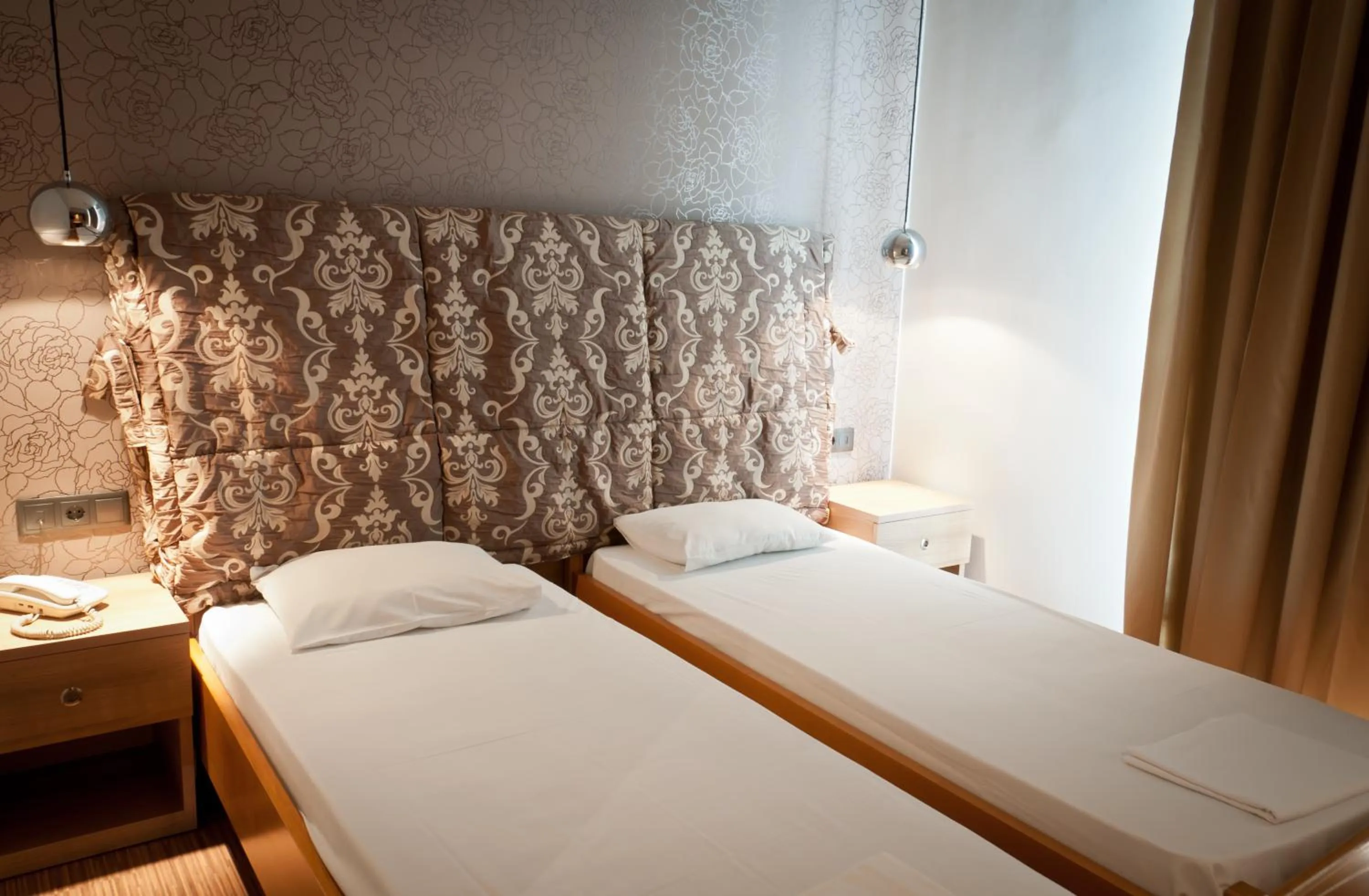 Bed in Metropolis Hotel