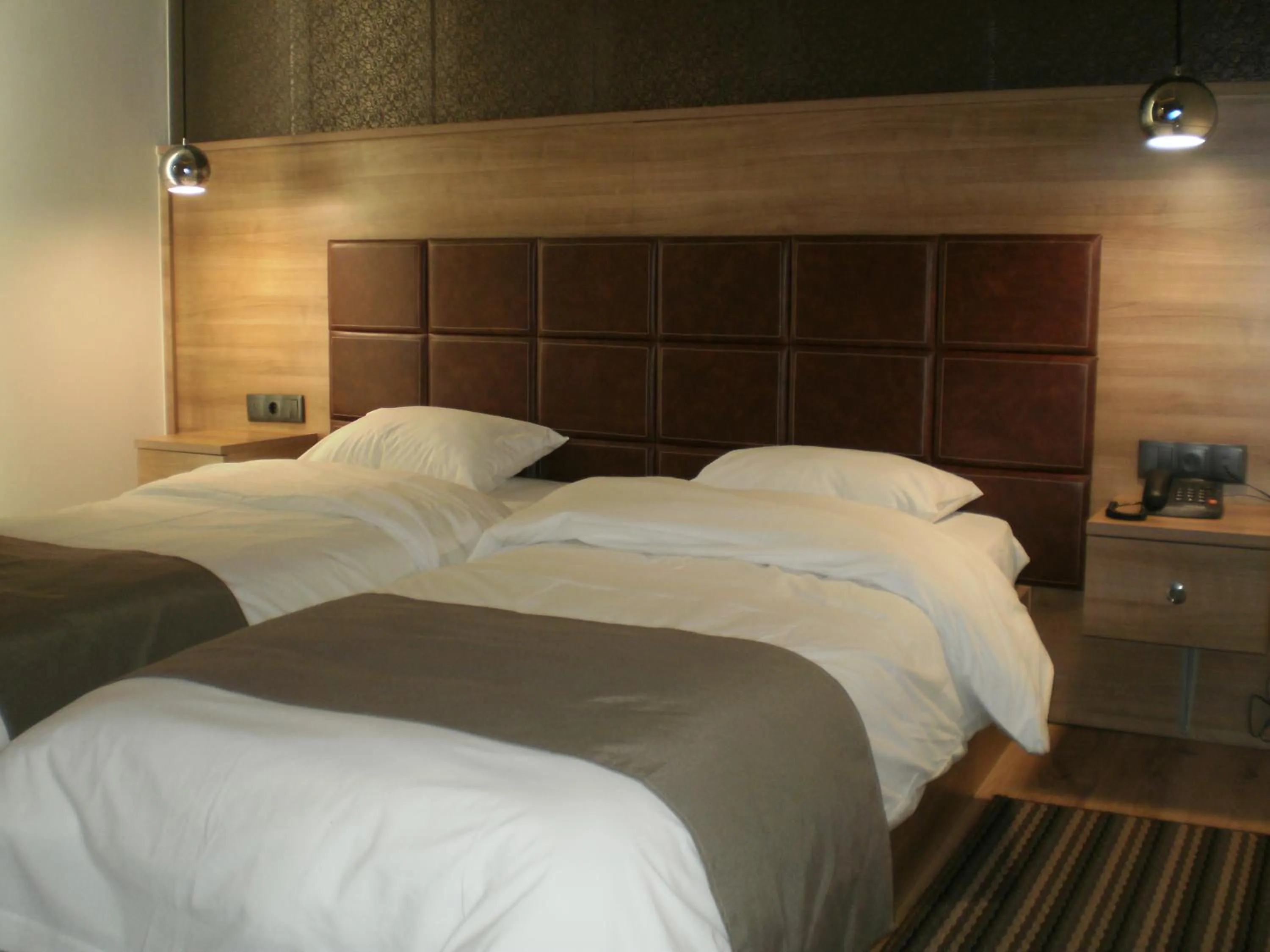 Bed in Metropolis Hotel