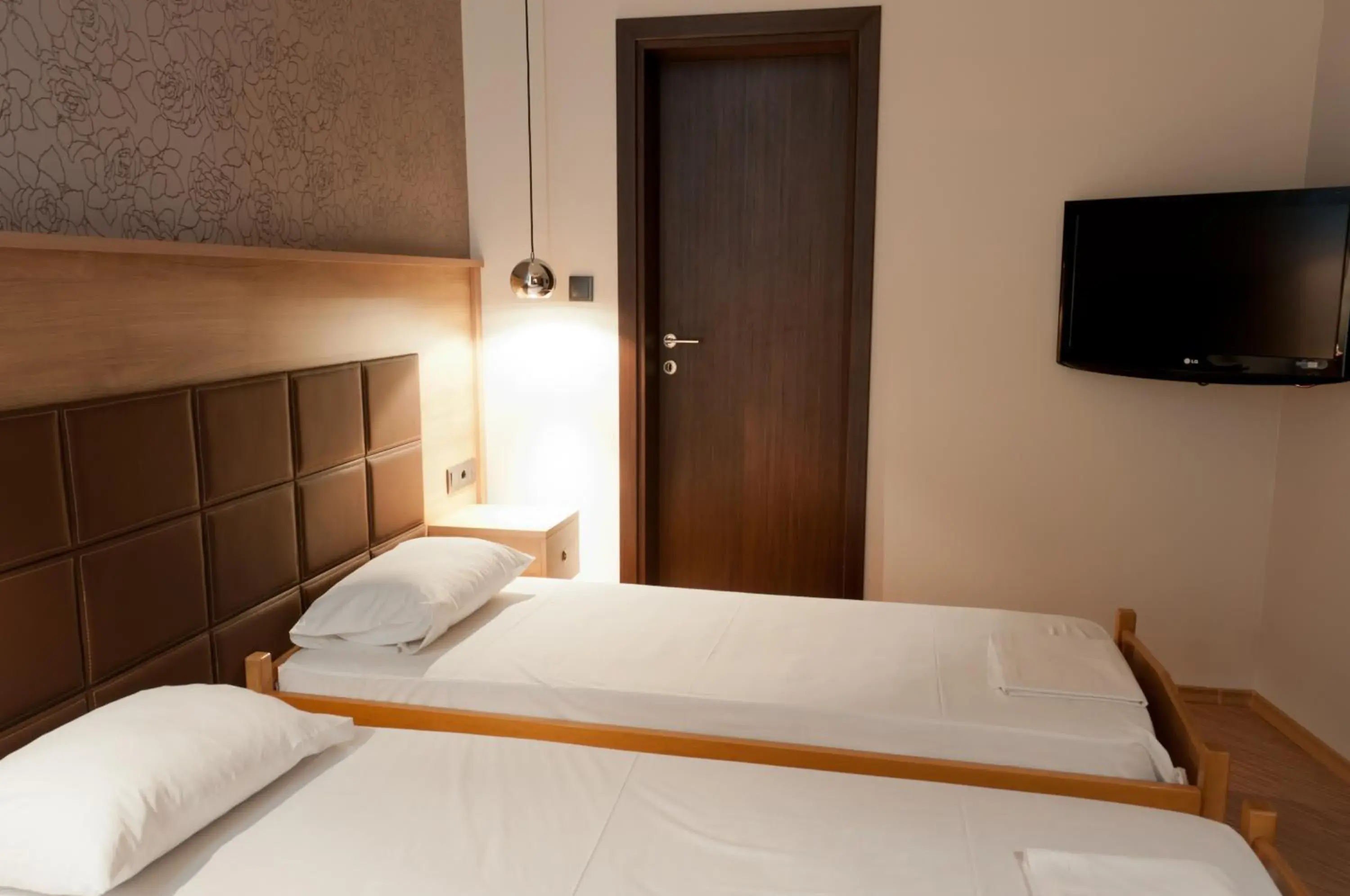 Bed in Metropolis Hotel Bed in Metropolis Hotel