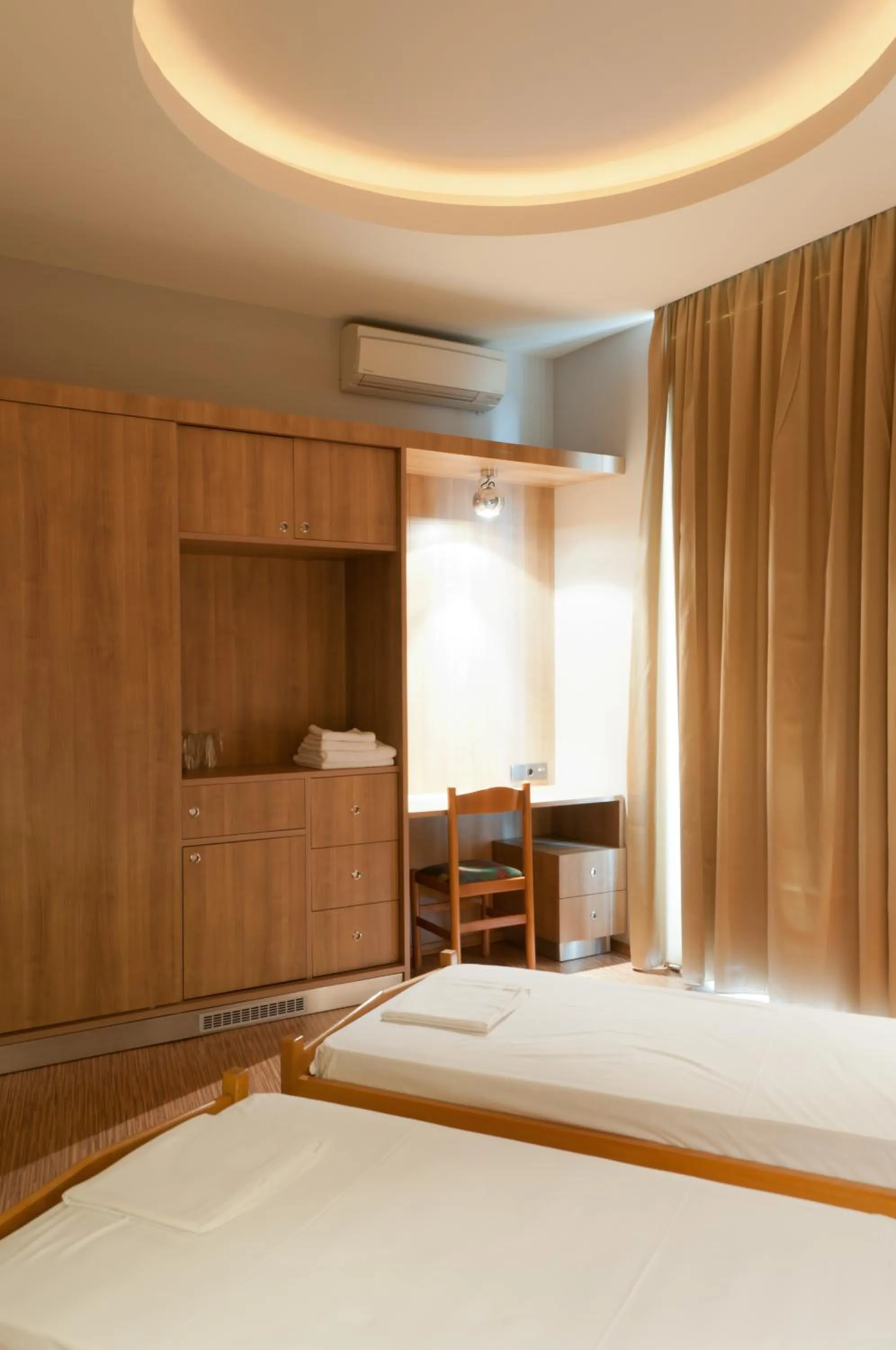 Bed in Metropolis Hotel