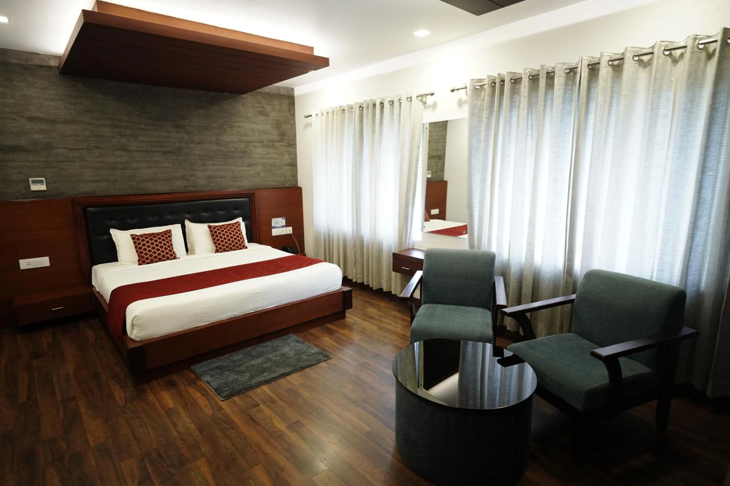 Seating area, Bed in Four N Square Residency