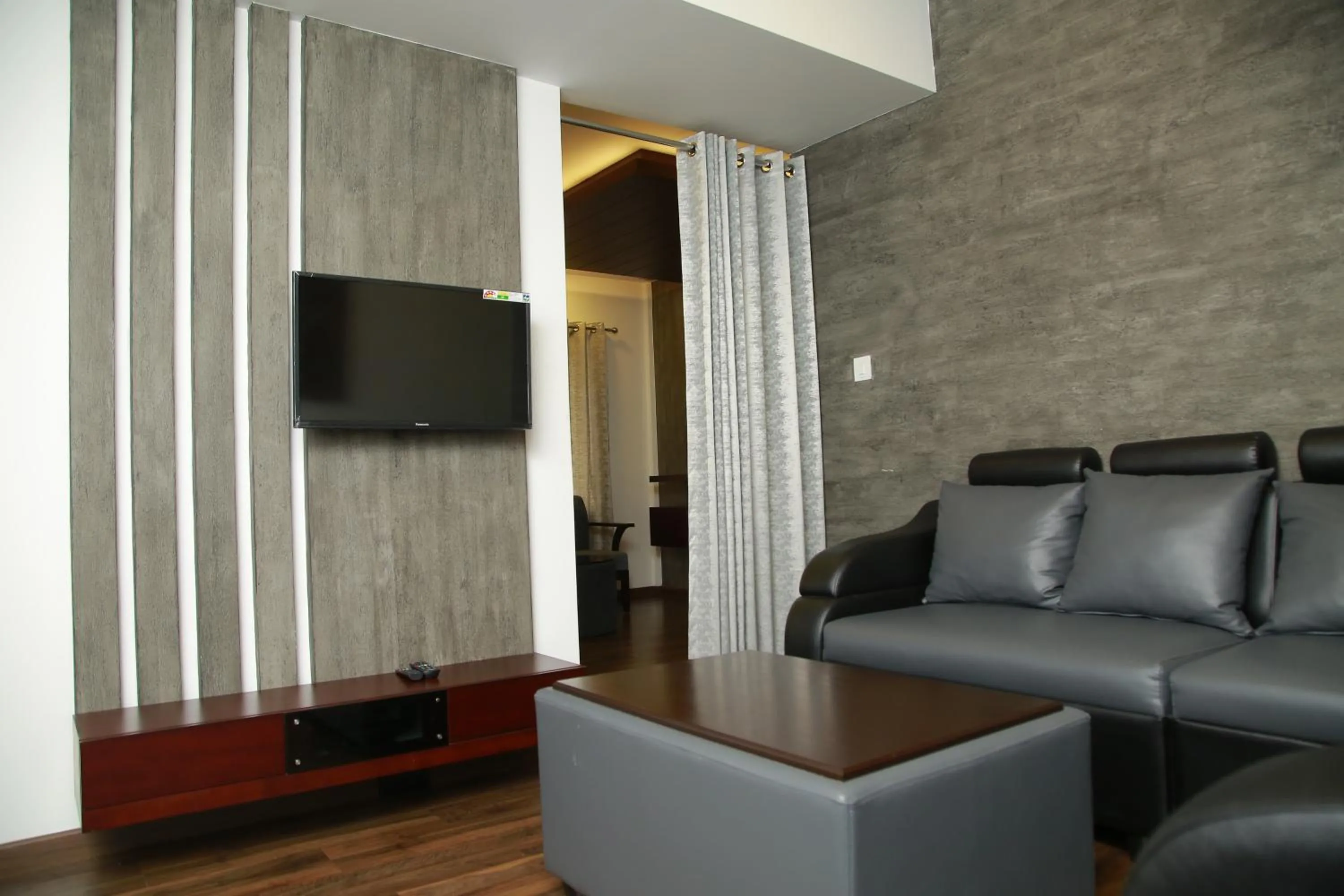 Communal lounge/ TV room in Four N Square Residency