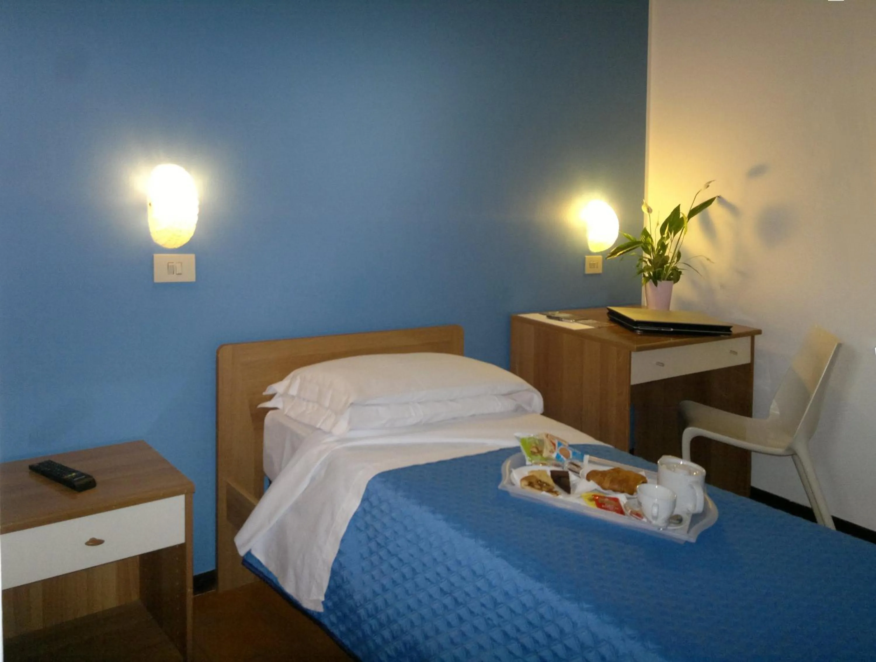 Bed in Albergo Papillon