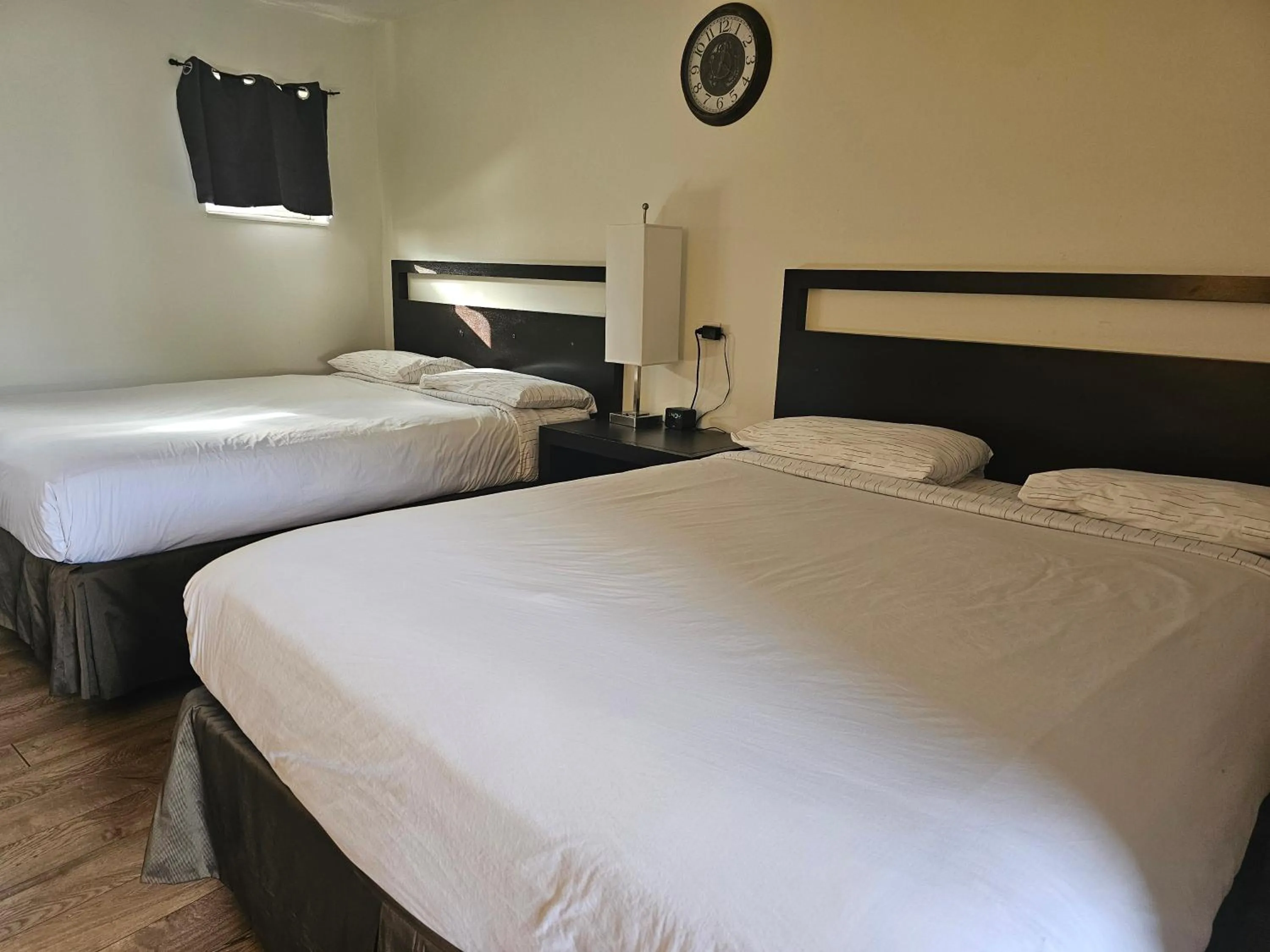 Bed in H&H Motor Lodge