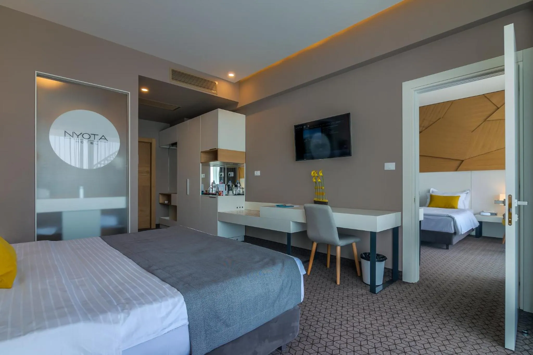 Bed in Nyota Hotel & Conference Center