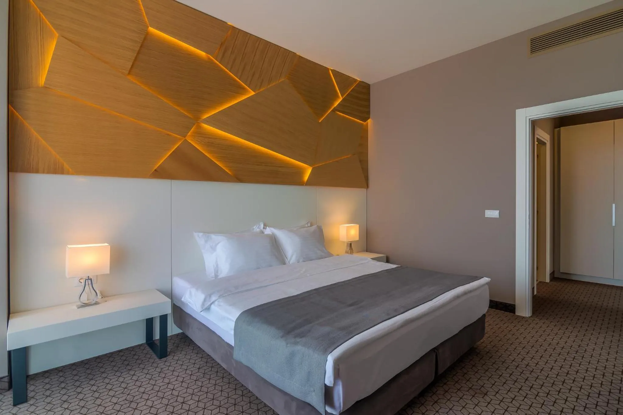 Bed in Nyota Hotel & Conference Center