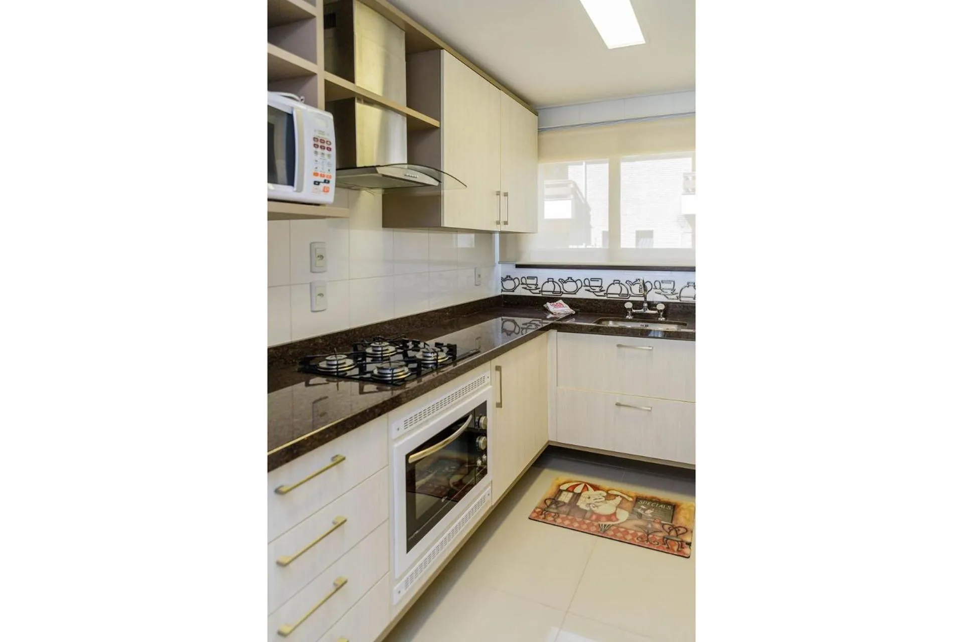 Kitchen or kitchenette in LOCAR-IN Gramado Residencial Siena Centro
