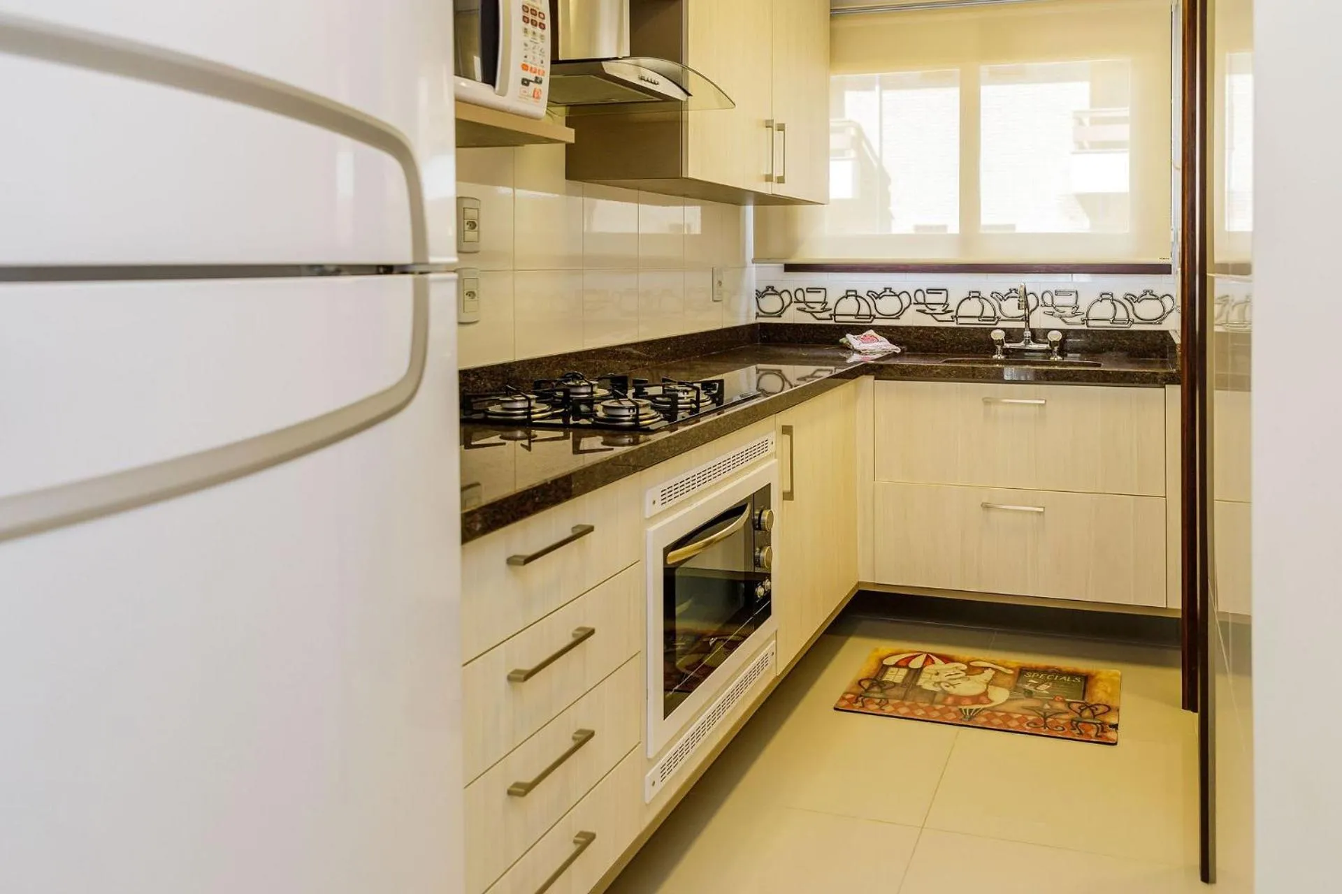 Kitchen or kitchenette in LOCAR-IN Gramado Residencial Siena Centro