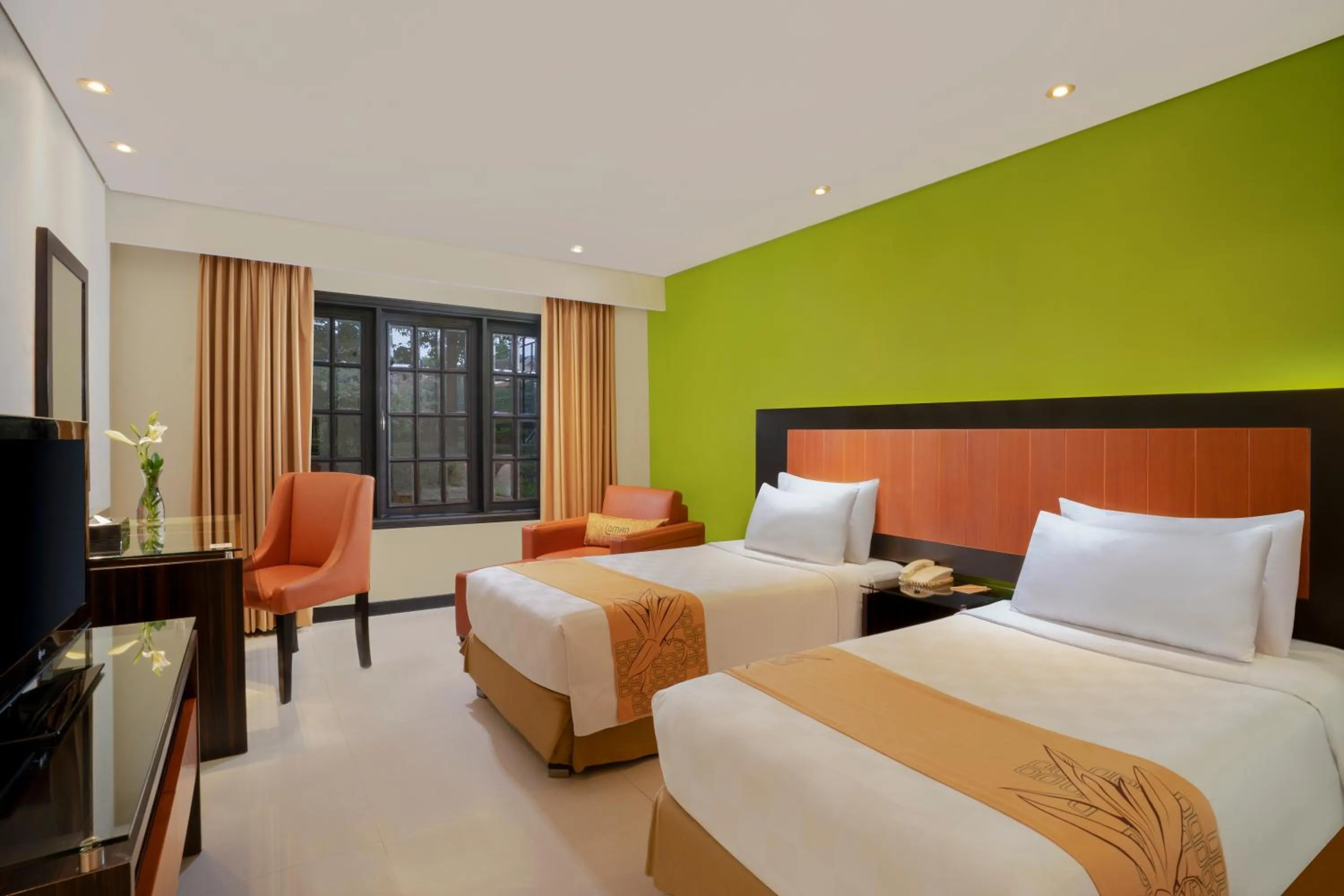 Bed in Loman Park Hotel Yogyakarta