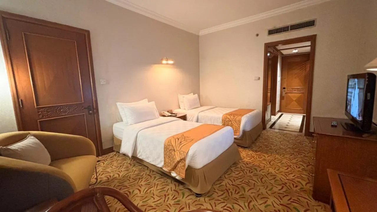 Bed in Loman Park Hotel Yogyakarta