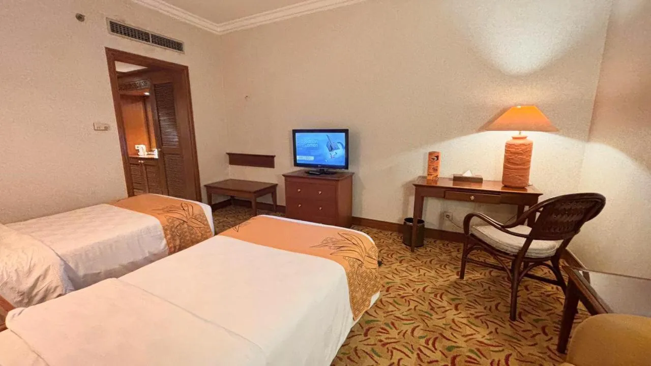 Bed in Loman Park Hotel Yogyakarta