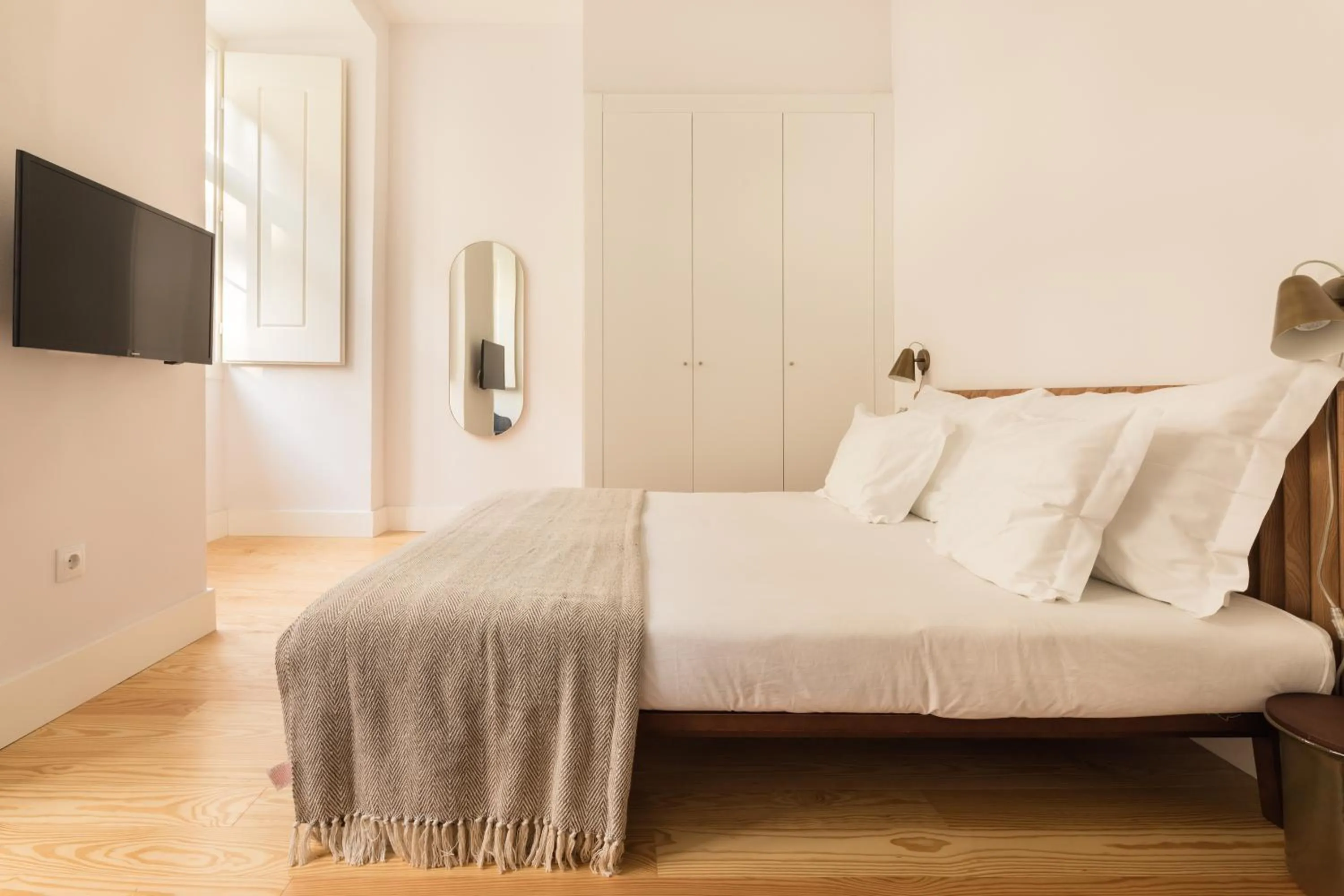 Bed in The Visionaire Apartments