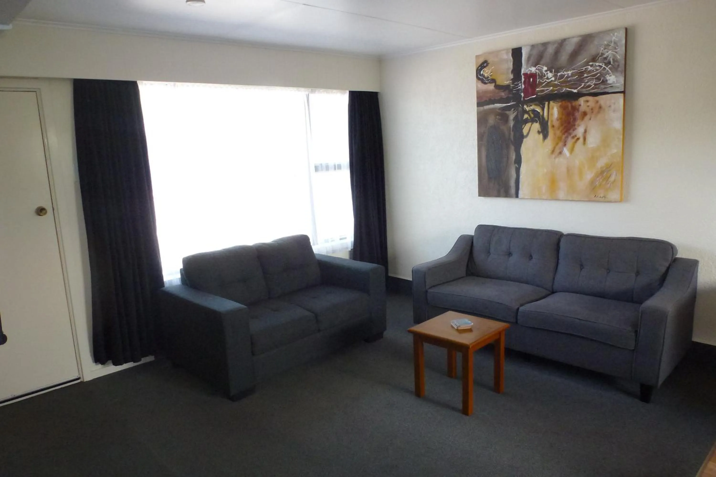 Living room in ASURE Adcroft Motel