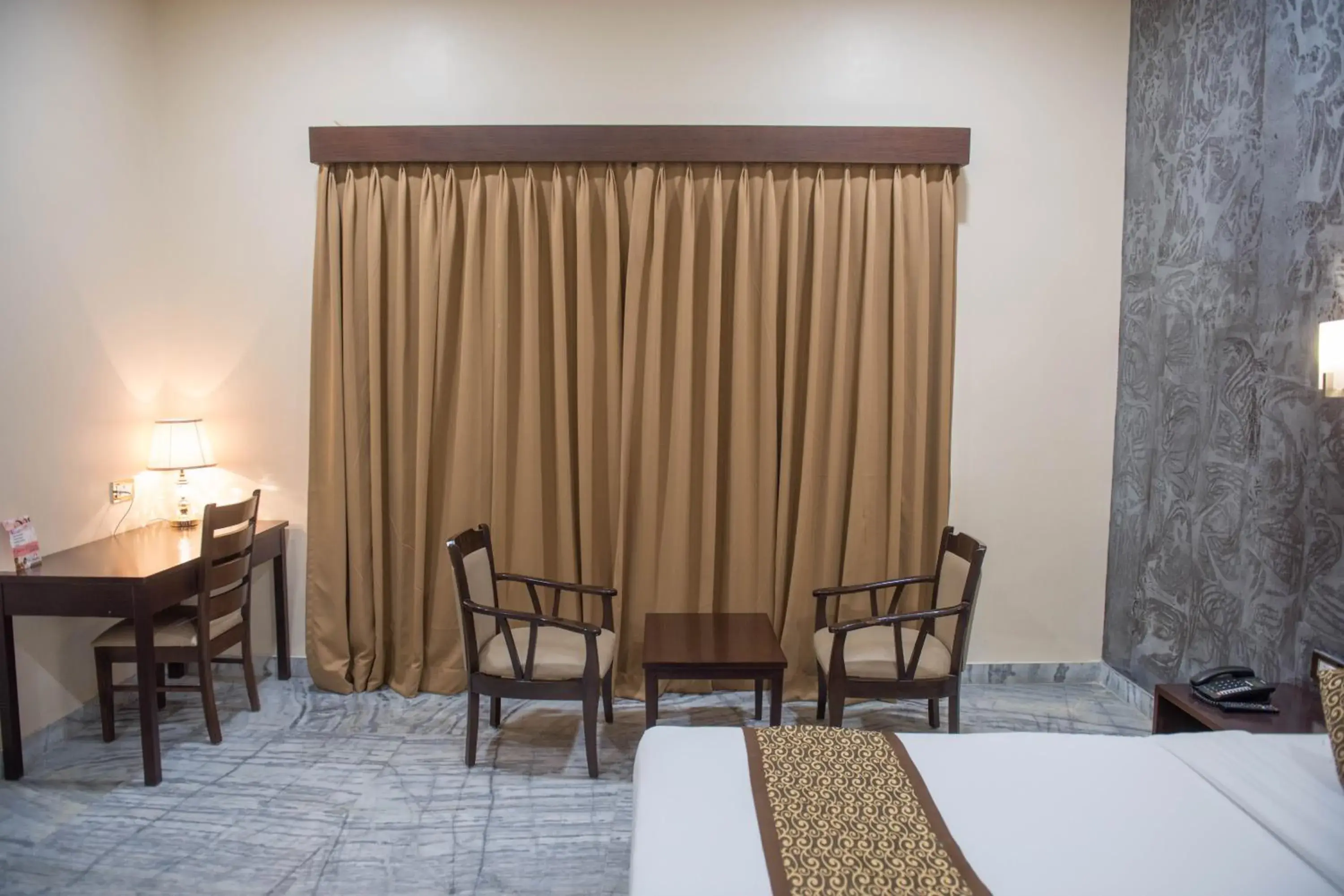 Seating area, Bed in Sun Hotel and Resort, Mount Abu Seating area, Bed in Sun Hotel and Resort, Mount Abu