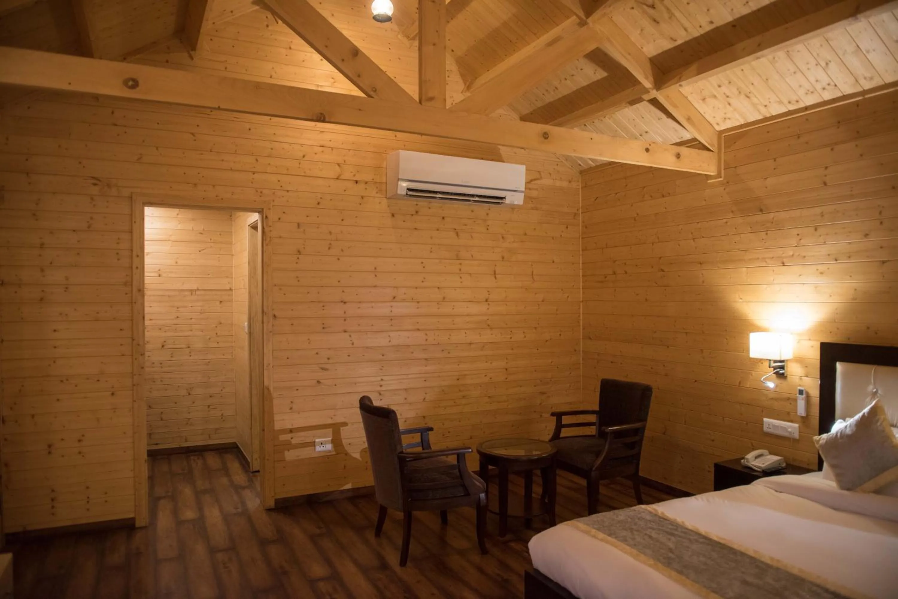 Seating area, Bed in Sun Hotel and Resort, Mount Abu