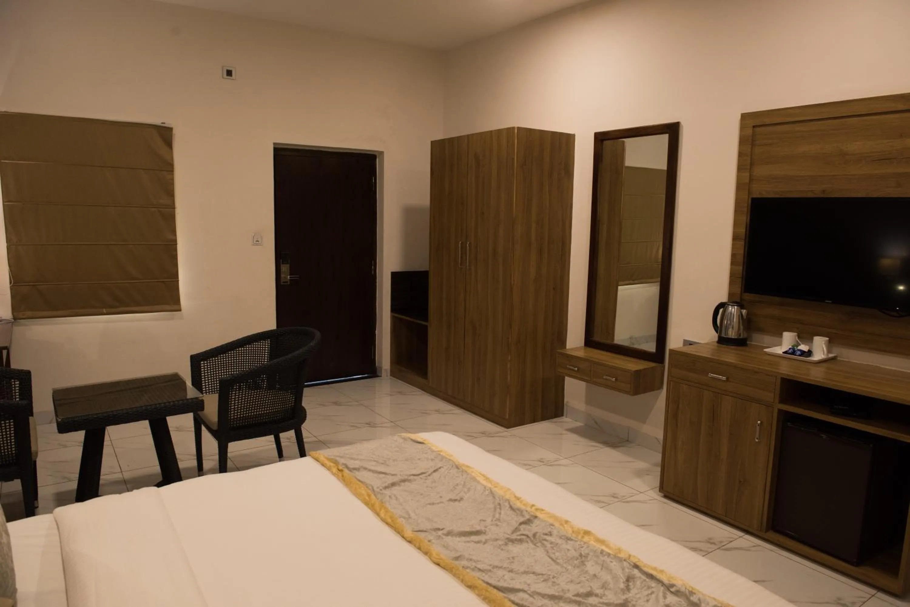 Seating area, Bed in Sun Hotel and Resort, Mount Abu