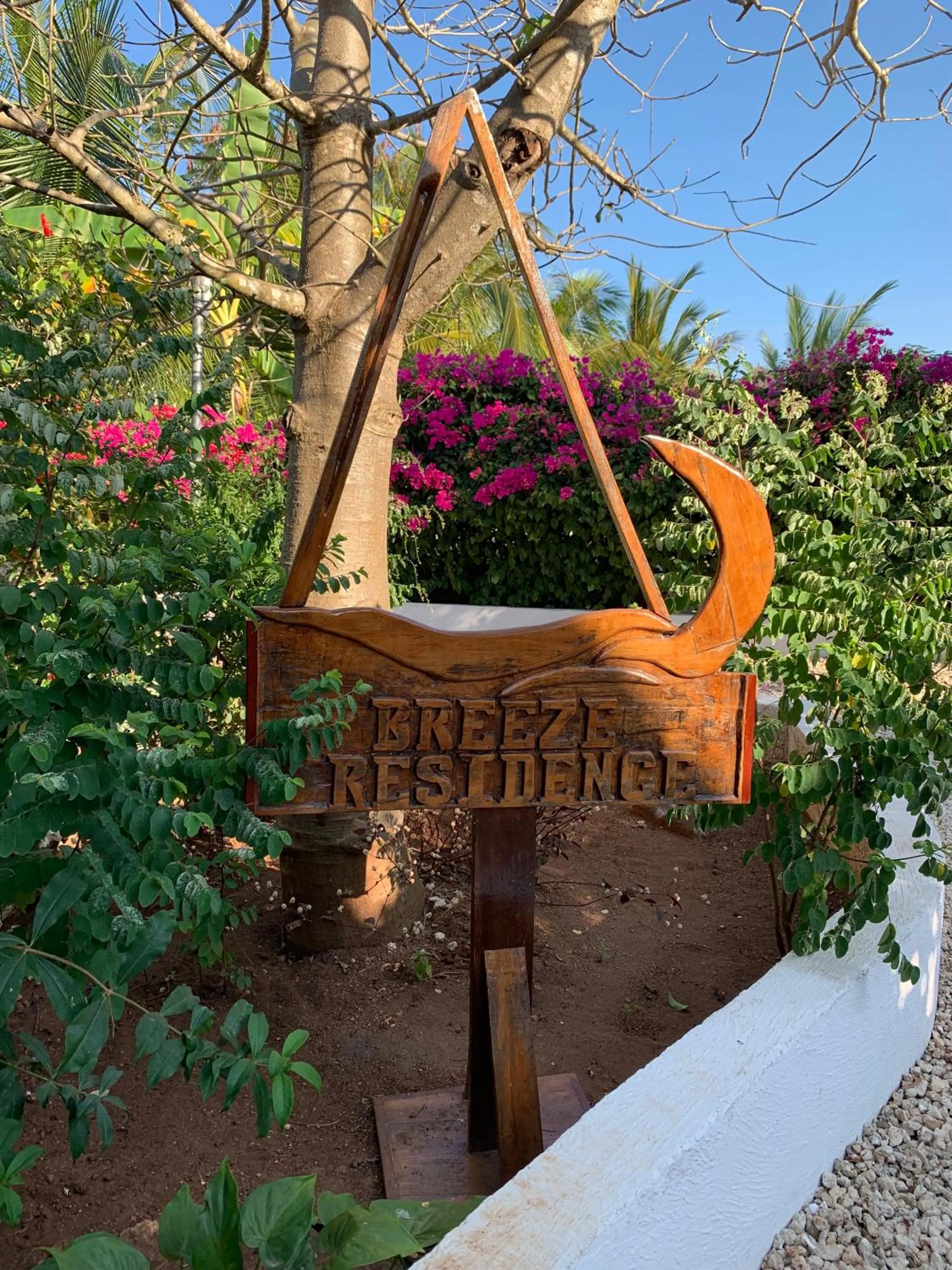 Property logo or sign in Breeze Residence