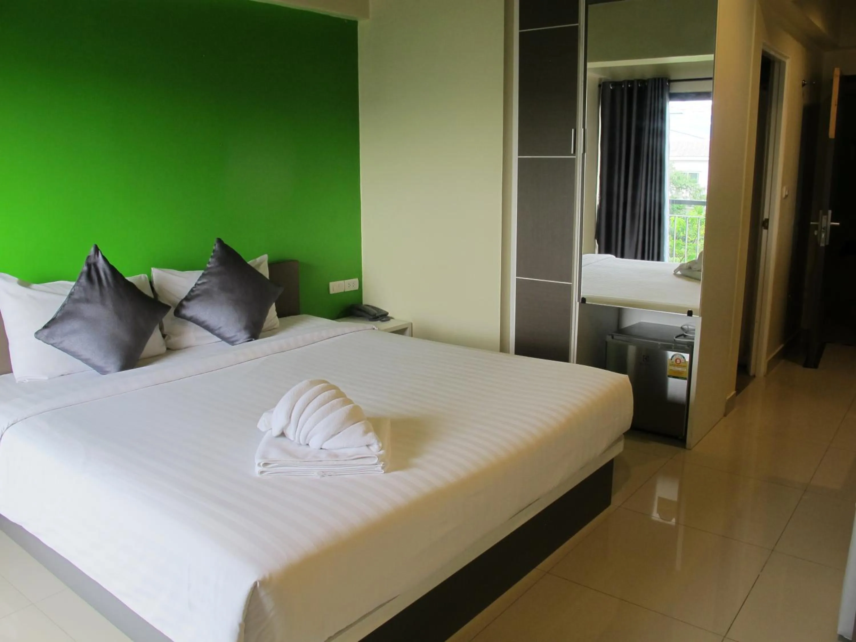 Bed in Suvarnabhumi Oriental Resort