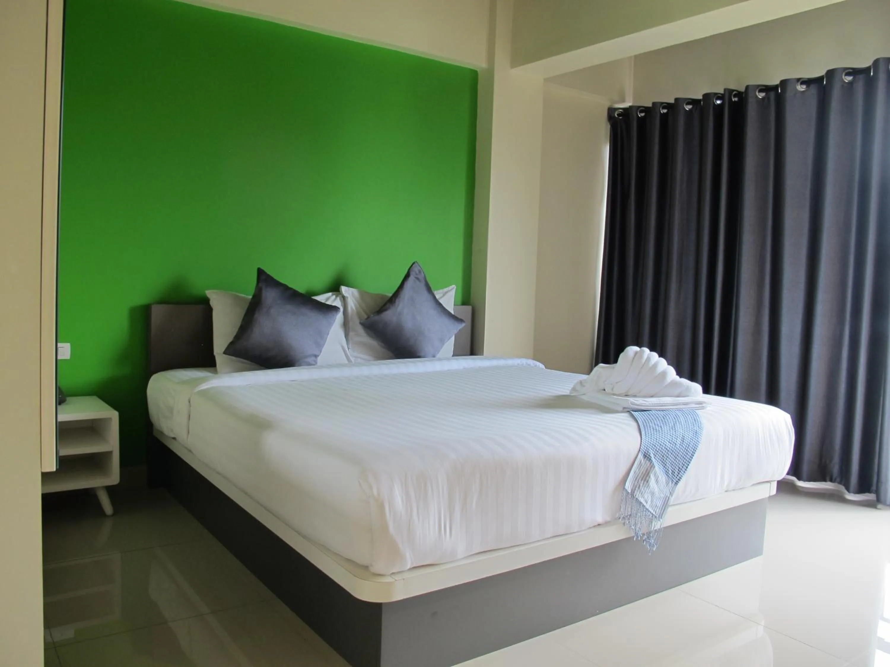 Bed in Suvarnabhumi Oriental Resort