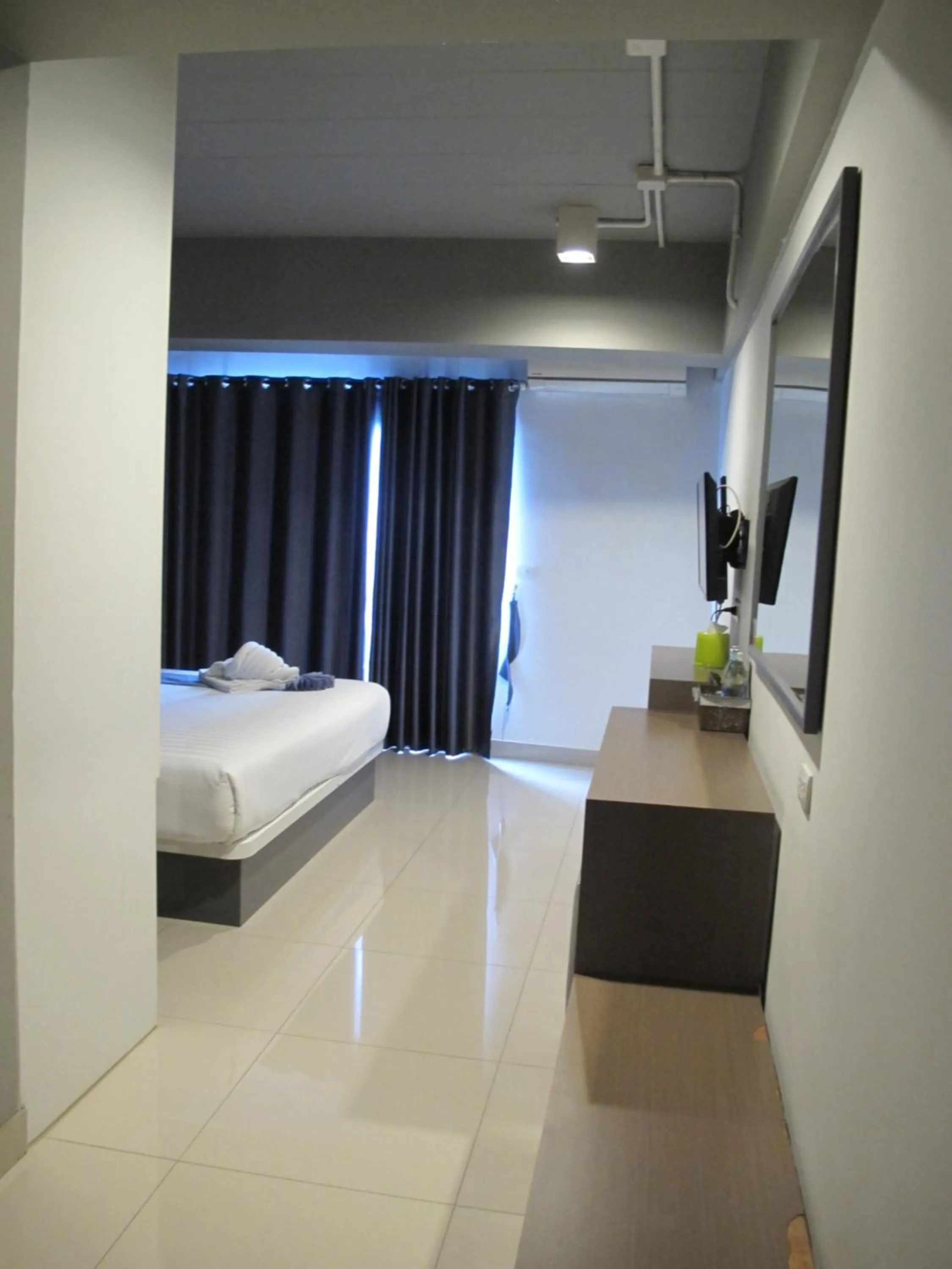 Bed in Suvarnabhumi Oriental Resort