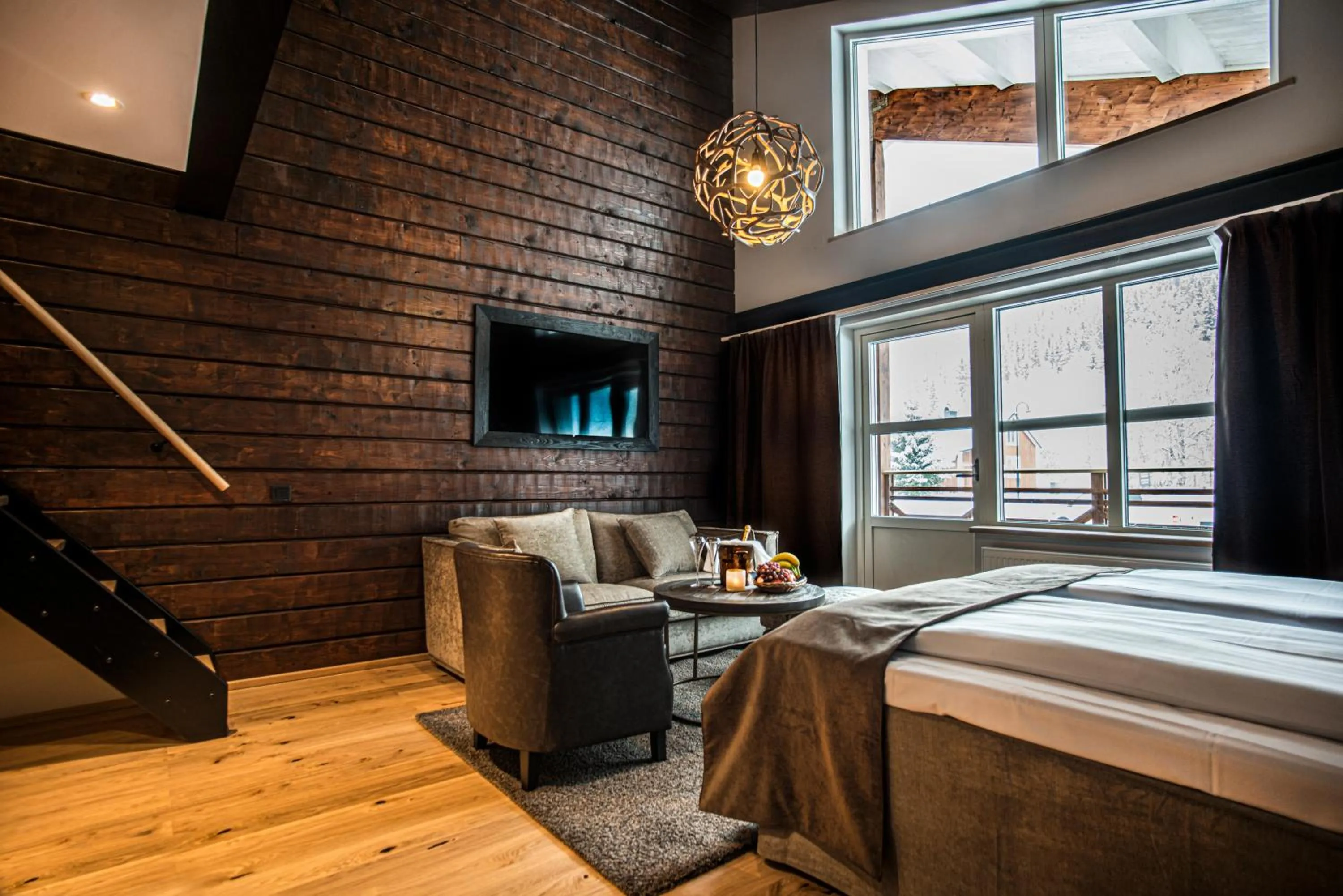 Seating area, Bed in Eriksgårdens Fjällhotell