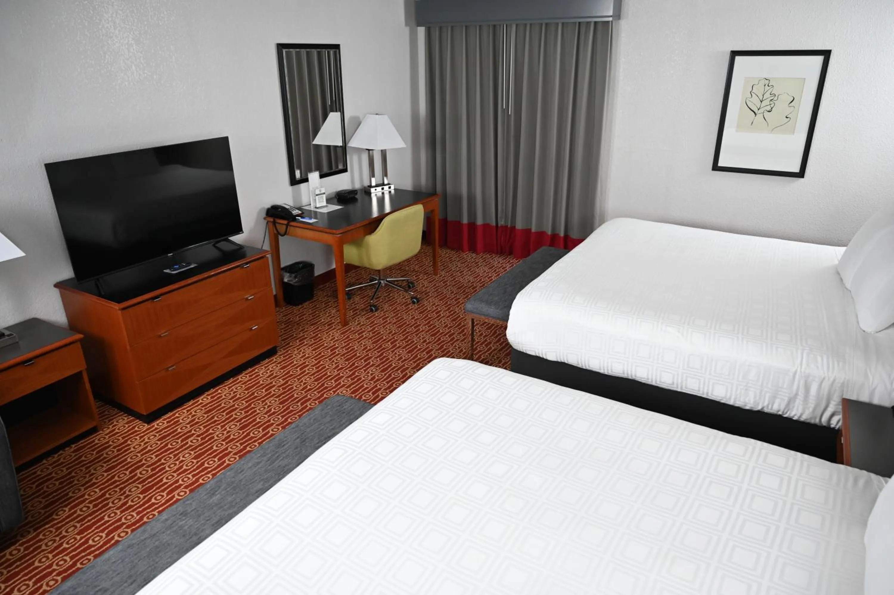 Bed in Atrium Hotel and Suites DFW Airport