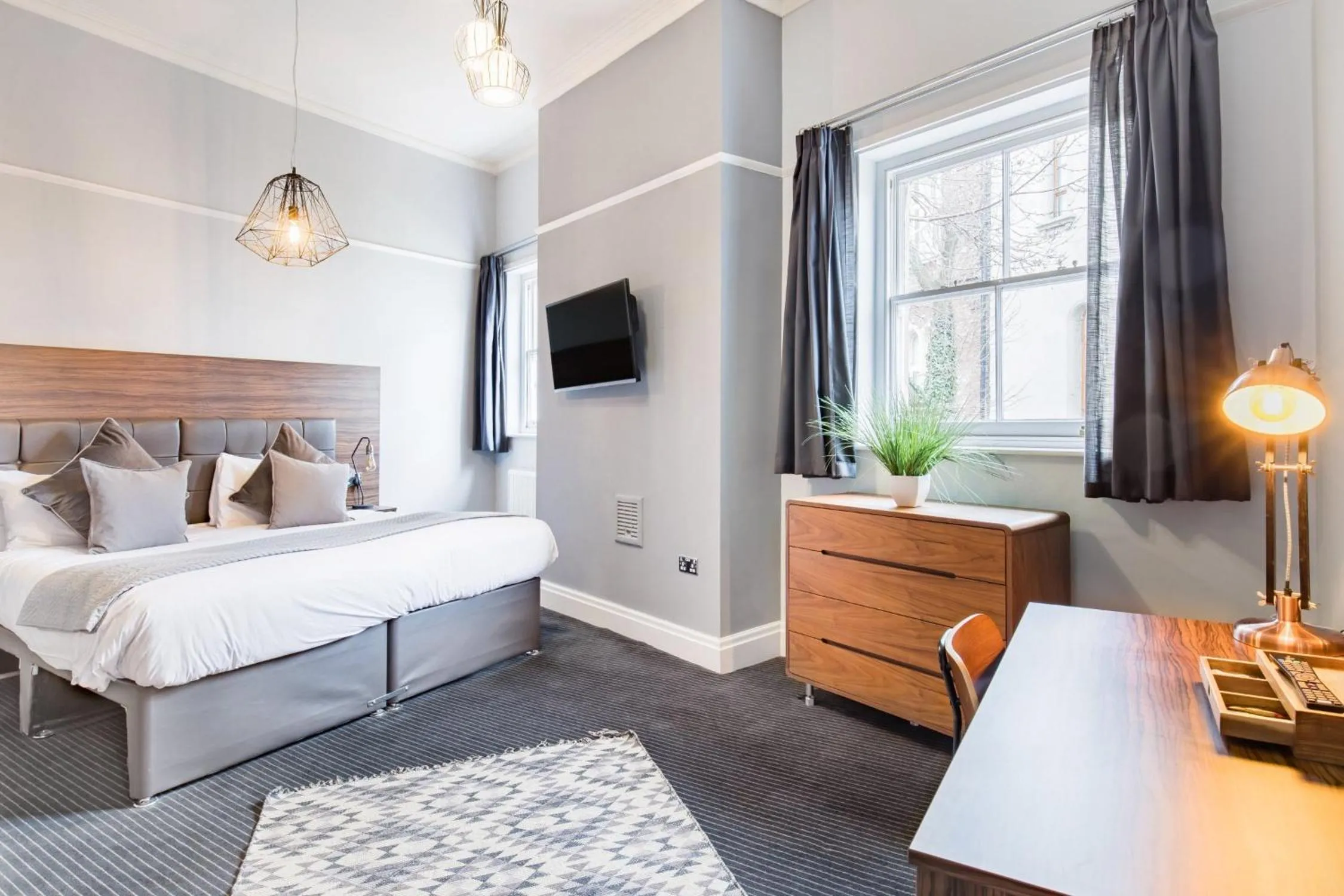 Bed in The Corson at Claremont Apartments