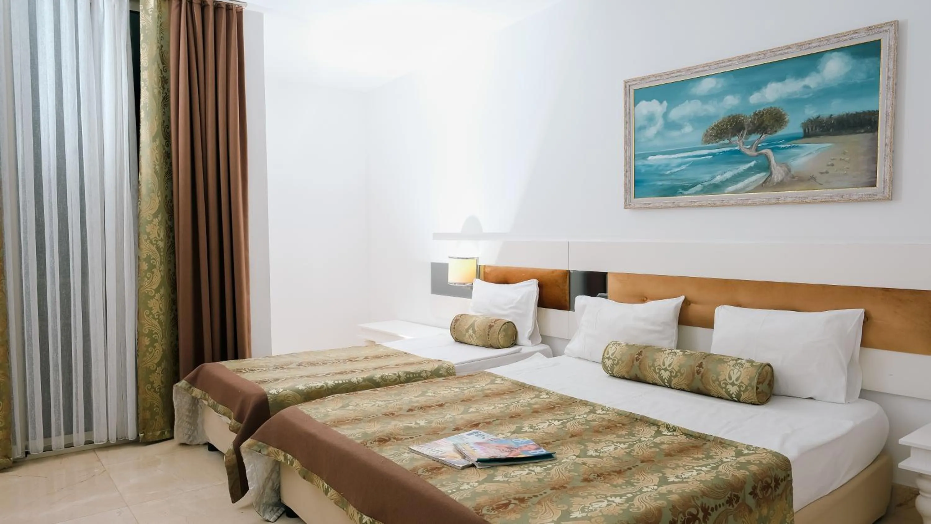 Bed in Onkel Resort Hotel